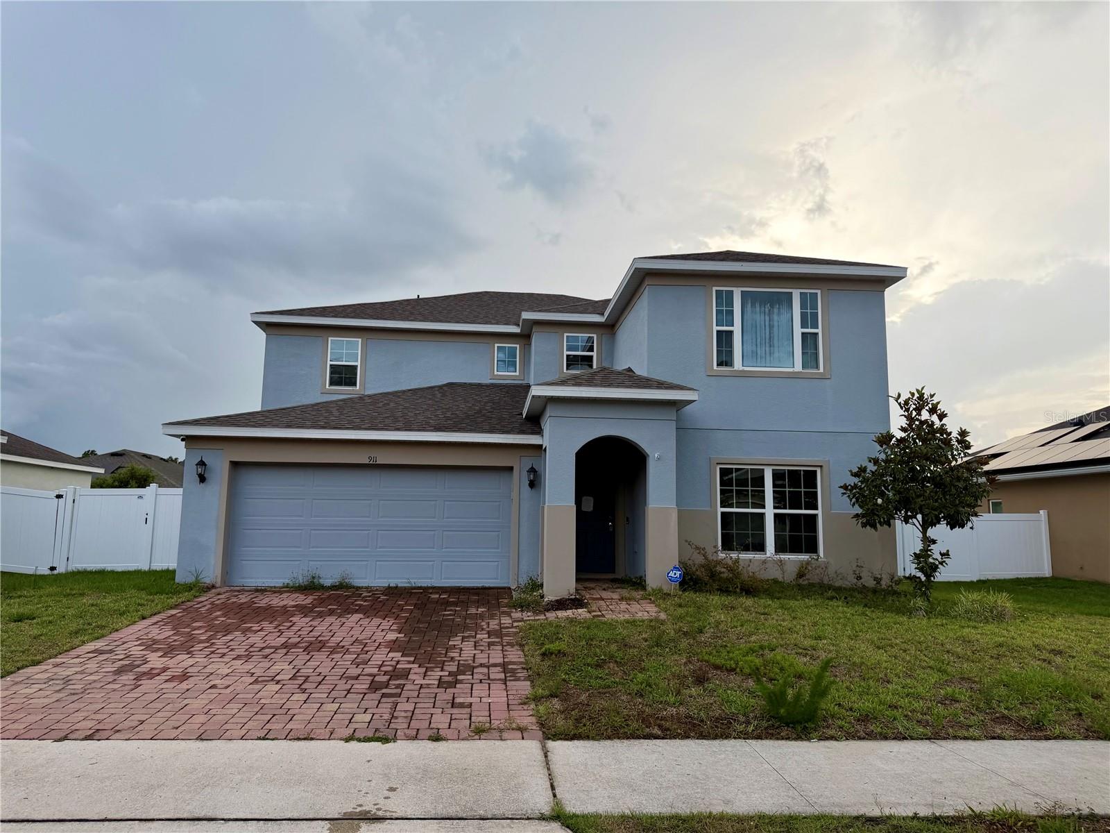 4 bedroom, 2.5 bath home located in a gated Davenport community. Built in 2021 and offering approximately 2,795 square feet of living space, this property features an open floor plan, spacious living areas, and a two car garage. Conveniently located near shopping, dining, and major roadways. Buyer to verify all property information