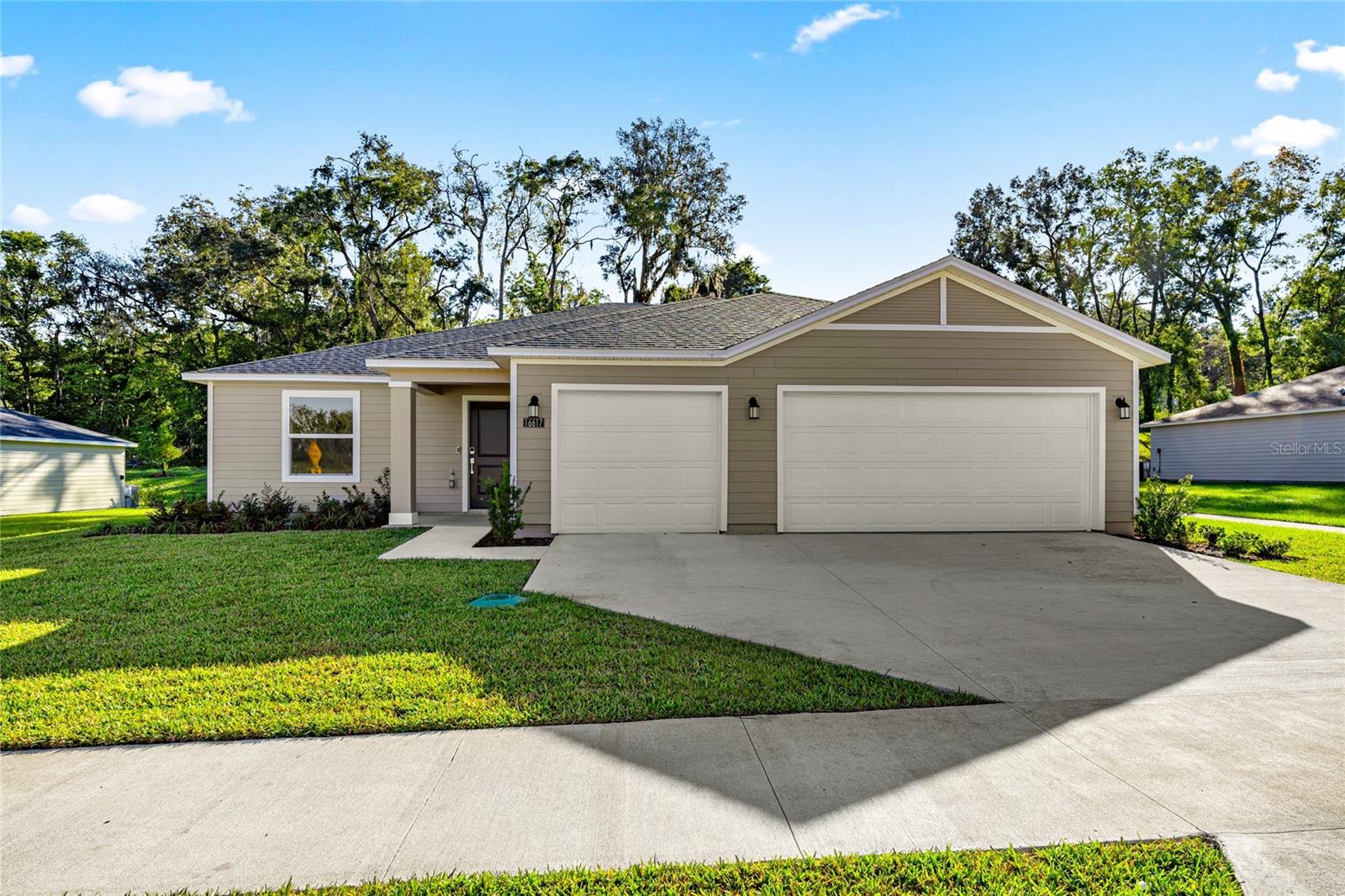This new single-level home boasts a low-maintenance layout with an inviting open-concept floorplan allowing for seamless entertaining. A versatile flex space is located off the foyer, with three bedrooms surrounding the main living area, including the luxurious owner’s suite with an en-suite bathroom and walk-in closet.