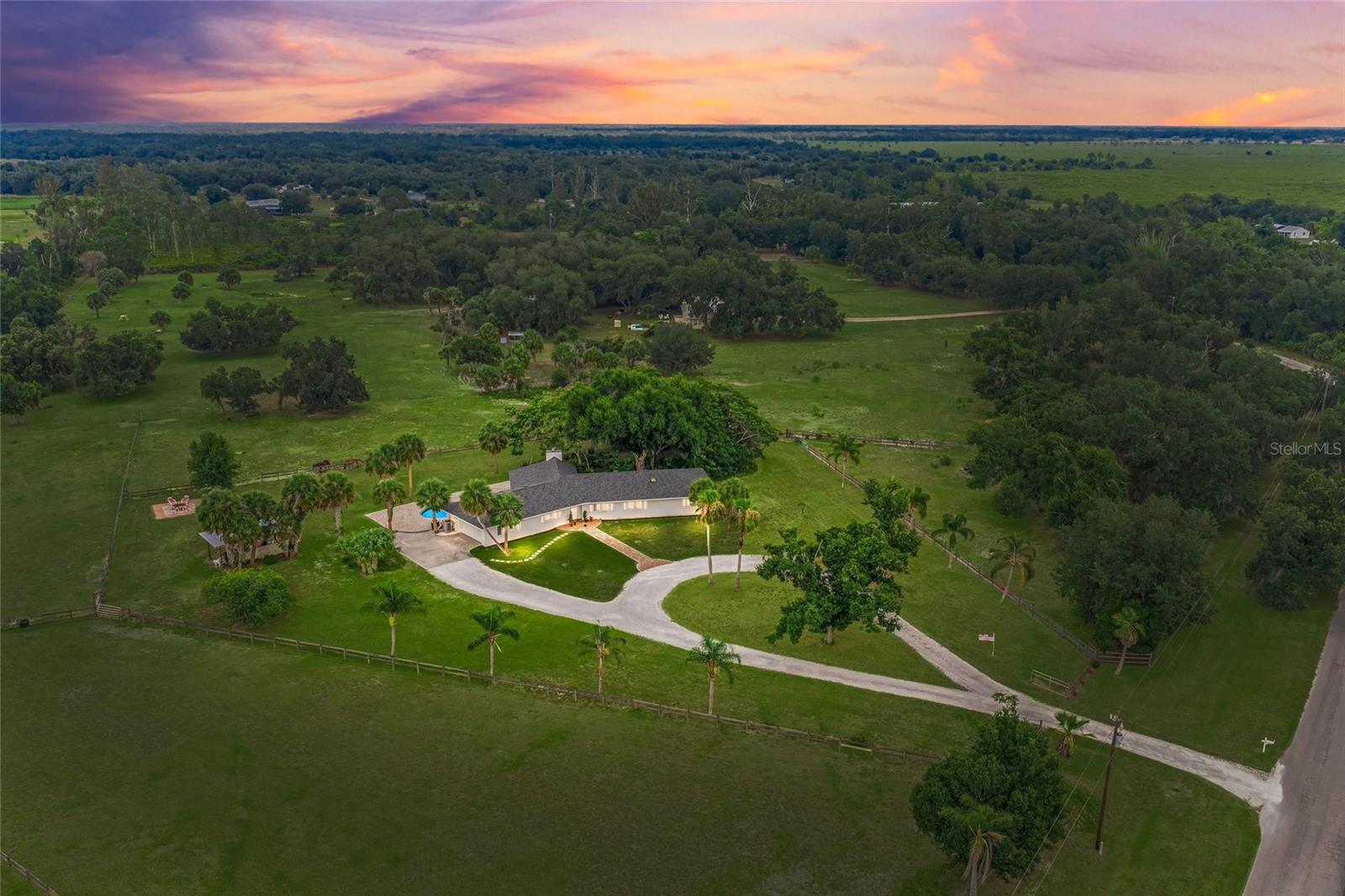 This is the one * Location, location, location * 'A" RATED SCHOOL DISTRICT * A MUST SEEE SPECTACULAR REMODELED HOME * The Pride of Current Ownership Shows * Enter the GATED FAMILY ESTATE and drive down the winding circular driveway * Your home is PERFECTLY POSITIONED on 7+/- HIGH & DRY ACRES with 6  FULLY FENCED & GATED PASTURES * This LOVINGLY RENOVATED HOME features 4 Bedrooms & 4 Baths PLUS Den/Office & a 2 Car Garage * This home is NOT REQUIRED TO HAVE FLOOD INSURANCE * Fenced & Cross Fenced with Multiple Pastures * This property borders one of the many dedicated NATURE TRAILS in the community which residents use for horseback riding, jogging, hiking or bike riding * You will love the THOUGHTFULLY REIMAGINED CHEF'S KITCHEN which is open to the living areas * The Primary Suite boasts a Spa-style Bath * There are 3 Additional Bedrooms with one of them as an En-suite Bedroom OR 2nd Suite * Living Room showcases a grand Fireplace with Vaulted, Wood Ceilings * This room has an ABUNDANCE OF NATURAL LIGHT and a SPECTACULAR VIEW OF THE POOL & LOT * The Pool is Heated and was RECENTLY RENOVATED with a SPACIOUS PAVER DECK AREA & COVERED LANAI * This is the perfect home to entertain family & friends or for simply relaxing in your slice of paradise * Th PANORAMIC VIEW of this 7 ACRE ESTATE MAKE THIS A MUST SEE PROPERTY * Bring the horses, chickens, kids, the whole family, all the toys - big & small! * The property is FENCED & GATED * MAKE THIS YOUR FAMILY ESTATE! * Beautiful Private Setting * Myakka Valley Ranches has miles of horse trails, an active saddle club, social club & book club * 'A' RATED SCHOOL DISTRICT * It's a short 10 minutes to Publix & other shopping * Short drive to Siesta Key Beach OR UTC Mall * Country feel yet close to town * One look & you'll fall in love *