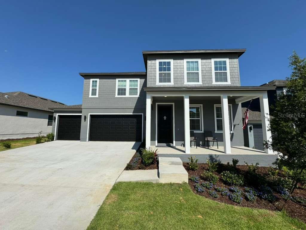 Stunning 5-Bedroom Home with 3-Car Garage, Soaring Ceilings & Oversized Screened Lanai in Minneola!

Welcome to this stunning two-story home in one of Clermont’s most desirable communities! Offering 5 bedrooms, 4 full bathrooms, and a spacious 3-car garage, this beautifully designed residence combines elegance, comfort, and everyday functionality.

From the moment you arrive, you’ll be greeted by a charming front porch, perfect for enjoying your morning coffee or relaxing in the evenings. Step inside to discover an impressive open-concept layout highlighted by soaring double-height ceilings in the living room, creating a bright and inviting atmosphere filled with natural light.

The heart of the home is the gorgeous gourmet kitchen, featuring quartz countertops, modern appliances, ample cabinetry, and generous counter space, making it ideal for both entertaining and daily living.

The spacious primary and secondary bedrooms provide plenty of room for family and guests, while the thoughtfully designed floor plan offers flexibility for multigenerational living, a home office, or a growing household.

Enjoy Florida living year-round from the oversized screened-in lanai, overlooking a large backyard with plenty of space for outdoor gatherings, play areas, or future customization.

Conveniently located near the Florida Turnpike, shopping, restaurants, and everyday essentials, this home also benefits from an exceptional location within an A-rated school district, with both the elementary and middle schools located within the community for added convenience.

Combining space, style, and an unbeatable location, this move-in-ready home is the perfect place to create lasting memories. Schedule your private showing today!