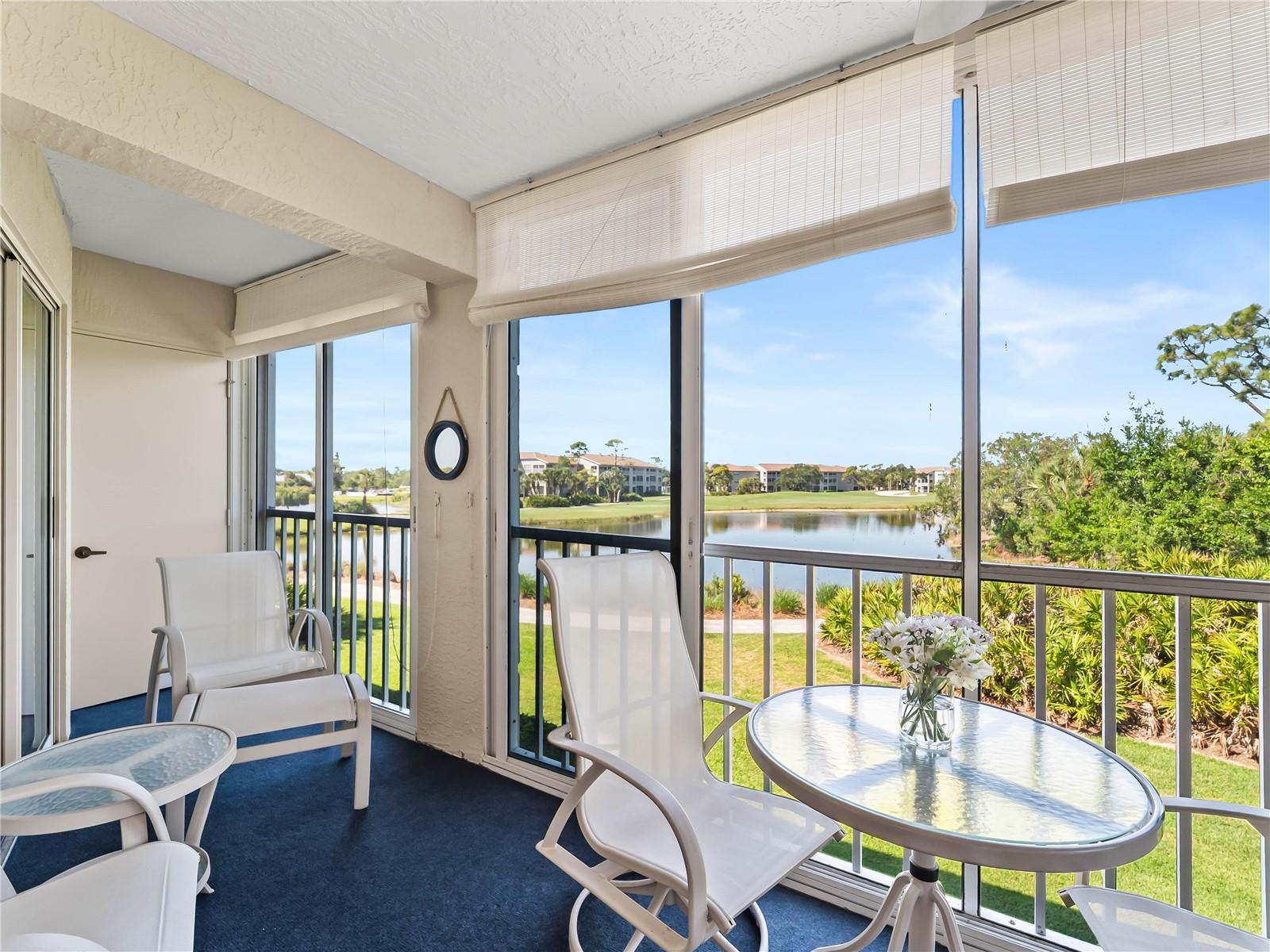 Welcome to 9330 Clubside Circle, Unit 3207, where breathtaking views of the lake, golf course, palm trees, and conservation area create the perfect Florida backdrop from the glassed and screened lanai. This beautifully furnished two-bedroom, two-bath condo features a bright and cheerful interior with quartz countertops, new plank flooring, a sunny eat-in kitchen, and an open floor plan designed to capture the stunning views from the kitchen, dining area, living room, and primary bedroom. Sliding glass doors from the primary suite open directly to the lanai, while the adjoining bath offers comfort and convenience. The guest bedroom is ideally situated next to the guest bath, and the condo also includes an in-unit washer and dryer. Located within the gated community of Stoneybrook Golf & Country Club, residents enjoy an active clubhouse and restaurant, Arthur Hills and Kipp Schulties designed golf courses, Har-Tru tennis courts, a large heated pool, and direct access to the Legacy Trail walking and biking trail. There is a community pool and tennis courts just across the parking lot from this condo. Just under 20 minutes from Siesta Key Beach and a short drive to downtown Sarasota for shopping, dining, and cultural attractions, this is an exceptional opportunity to enjoy the ultimate Florida country club lifestyle. Golf membership is required.