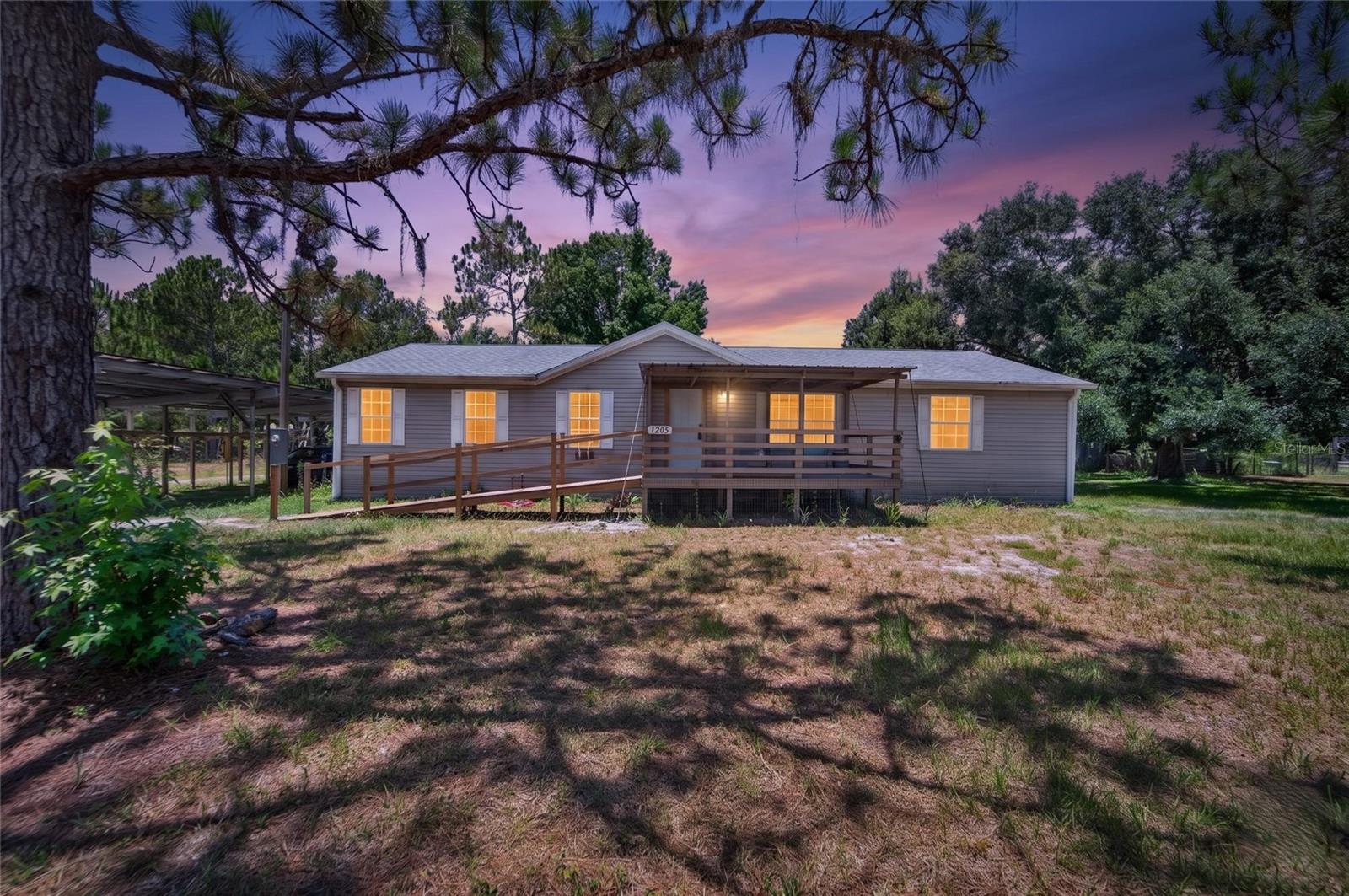 Fully paid-off solar system allows this home to operate virtually off-grid! Rare opportunity to own 1.35 acres with a beautiful pond, no HOA, and no CDD—offering the freedom and privacy that's becoming increasingly difficult to find. Bring your RV, boat, trailers, and all your recreational toys while enjoying the perfect blend of country living with convenient access to schools, shopping, dining, and local destinations.

This spacious split-bedroom home features an open-concept floor plan designed for both everyday living and entertaining. The oversized primary suite includes a private retreat ideal for a home office, sitting area, nursery, or fitness room, along with two large walk-in closets and a spacious en-suite bath. The secondary bedrooms and full bath are thoughtfully situated on the opposite side of the home for added privacy.

The expansive kitchen offers beautiful oak cabinetry, abundant storage, and overlooks the main living areas, making it the heart of the home. A separate laundry room and generous storage throughout add to the home's functionality.

An irrigation well services the property and can also be used to maintain the pond, helping keep outdoor maintenance costs low. Whether you're looking for room to roam, a peaceful country setting, or a property without neighborhood restrictions, this home delivers endless possibilities with the space, privacy, and freedom you've been searching for.