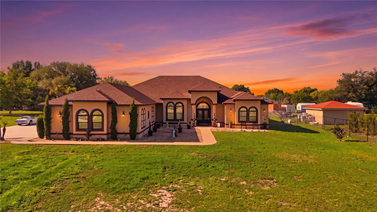 Welcome to a rare opportunity to own a beautifully appointed estate home on 1.11 acres with **no HOA**, offering the space, privacy, and freedom that are becoming increasingly difficult to find in Clermont. Behind the private gated entrance, this exceptional 6-bedroom, 4-bathroom pool home provides nearly 3,900 square feet of thoughtfully designed living space.

Built in 2019, this residence blends luxury and comfort with spacious living areas, soaring ceilings, and abundant natural light throughout. The expansive kitchen is designed for both everyday living and entertaining, featuring premium finishes, generous counter space, ample storage, and seamless flow into the main living and dining areas.

Step outside to your private backyard retreat complete with a resort-style pool and spa, expansive outdoor living space, and plenty of room to relax, entertain, or enjoy Florida living year-round.

The flexible floor plan offers ample space for multi-generational living, remote work, homeschooling, fitness, or guest accommodations. Conveniently located near shopping, dining, medical facilities, top-rated schools, and major highways, this property provides the perfect balance of luxury, privacy, and accessibility.

If you've been searching for a move-in-ready estate home with room to grow, space to entertain, and the freedom that comes with acreage living and no HOA restrictions, this is an opportunity you won't want to miss.
Some photos are virtually stagged