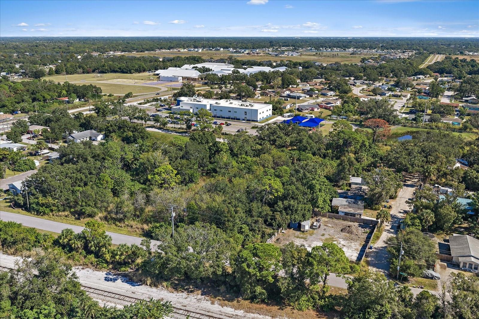 1.7-acre parcel offering a versatile multi-family development opportunity in the heart of Newtown. Ideally positioned one block east of US-301, 2.5 miles from downtown Sarasota, and 3 miles from SRQ International Airport. The site also sits directly across from Dreamer’s Academy and only 2 blocks from Booker Middle School, providing strong visibility and accessibility. The future expansion plans for the Legacy Trail will run right behind this property. This location would be perfect for a small townhome community or a thoughtfully designed daycare facility for either children or adults. Phase I Environmental assessment has already been completed, streamlining the path toward development.
