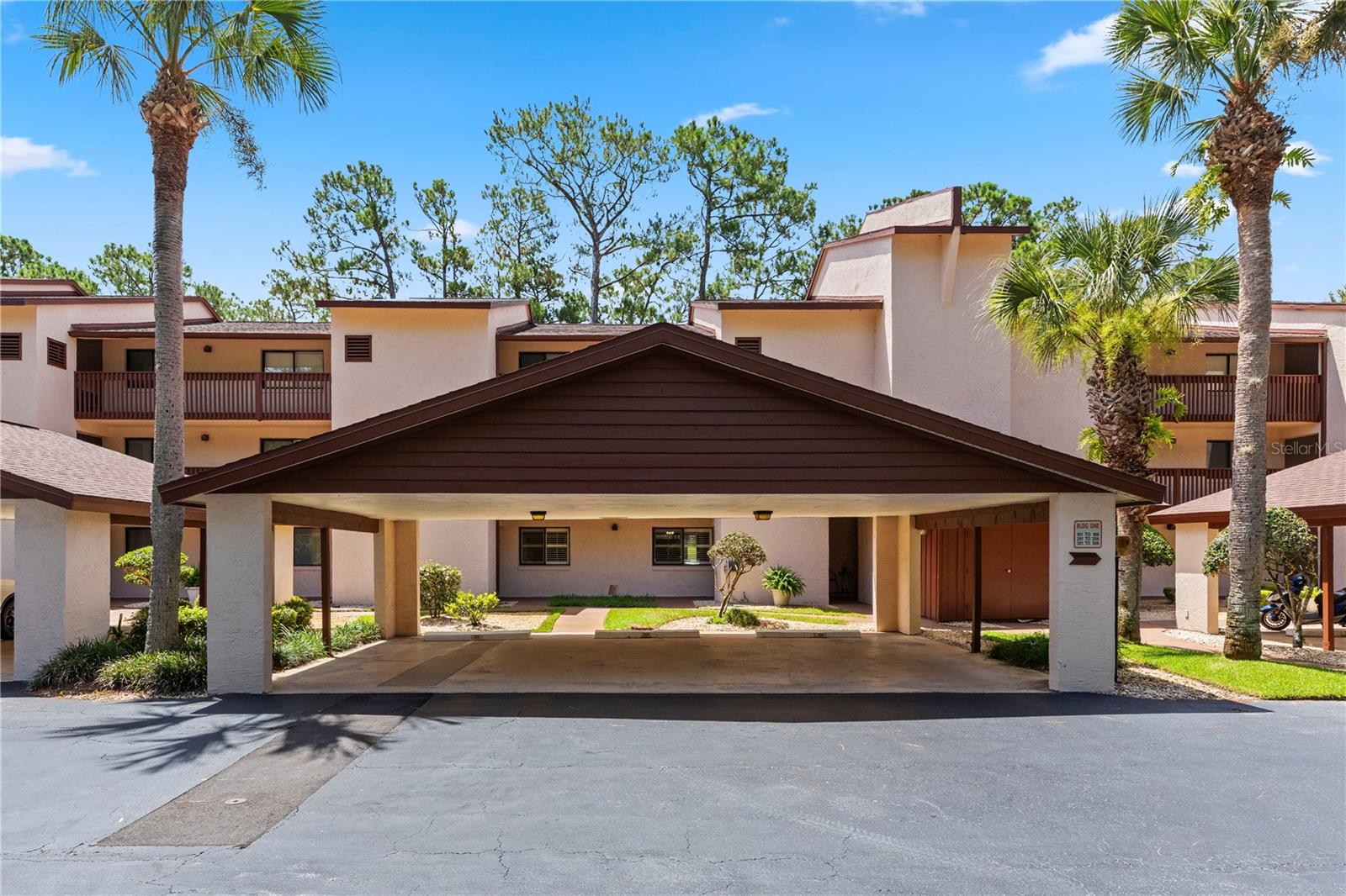 **NEWER APPLIANCES**ALL ASSESSMENTS PAID**AMAZING LOCATION** This stunning condo features NO CARPET, with a 4 year old AC and appliances. The huge OPEN CONCEPT creates a massive living and dining space. Boasting a SPLIT BEDROOM FLOOR PLAN, both bedrooms feature walk-in closets. The primary suite offers private access to a large SCREENED-IN LANAI, a sit-down vanity, and a floor to ceiling tile step-in shower. The bright kitchen has stainless steel appliances and its own lanai access. Relax in the spacious backyard overlooking a peaceful forest. Enjoy tons of storage, including an outdoor utility closet with a water filtration system. Includes a personal COVERED PARKING SPOT and all paid assessments. Minutes from shopping, dining, I-95, Daytona Speedway, Daytona International Airport, Embry Riddle Aeronautical University, and only 15 minutes from the beach! Don’t miss out on this fantastic opportunity to claim your new Florida lifestyle, before it’s gone!