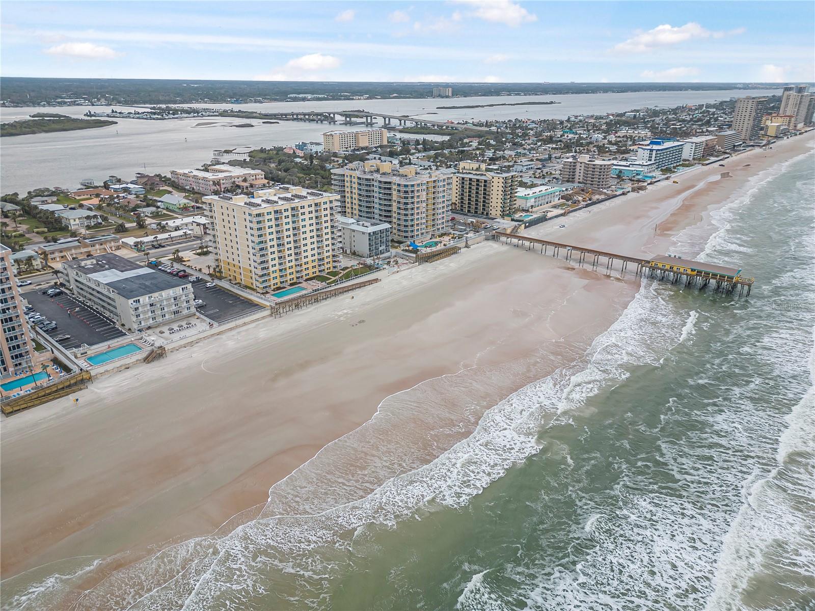 Stunning Fully Renovated Condo in Daytona Beach Shores! Experience the best of coastal living in this beautifully remodeled and tastefully decorated condo, ideally located just steps from the beach. This move-in-ready residence features a bright, open floor plan with modern finishes throughout and partial ocean views from the living room. Enjoy spectacular sunrises just across the street from the Atlantic Ocean.
The updated kitchen showcases sleek cabinetry, stainless steel appliances, and contemporary finishes, seamlessly flowing into the spacious living and dining areas—perfect for everyday living or entertaining. Every detail has been thoughtfully upgraded, creating a  comfortable beach retreat.
Whether you're searching for a primary residence, a vacation home, or an excellent investment opportunity with rental potential, this exceptional property checks every box. Conveniently located in the heart of Daytona Beach Shores, you'll be just minutes from restaurants, shopping, entertainment, golf, and all the attractions that make this coastal community so desirable.
Don't miss this opportunity to own your own piece of paradise. Schedule your private showing today!