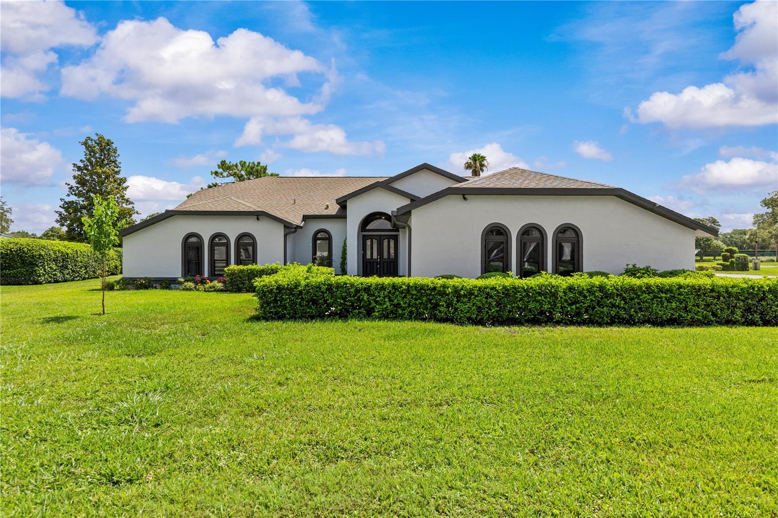 Virtually Staged. Welcome to this spacious 3-bedroom, 3-bathroom home set on a just-under-½-acre corner lot within a secure, gated country club community. Thoughtfully designed for both comfort and function, the home offers an open living area with soaring ceilings and a cozy fireplace. Triple disappearing sliders open directly onto the covered 25x10 lanai, seamlessly connecting indoor and outdoor living. Throughout the home you'll find ceramic tile and polished hardwood laminate flooring.
The primary suite is a private retreat with direct lanai access, dual closets, and an en-suite bathroom featuring a garden tub, separate shower, and twin vanity with granite counters. Two additional bedrooms with walk-in closets and an updated guest bathroom provide ample space for family or guests.
At the center of the home is a screened outdoor patio with a large 30x15 heated pool and spa, a paver deck, and a covered lanai with an outdoor kitchen—ideal for al-fresco entertaining. A dedicated pool shower bathroom keeps swimmers out of the house. The entire home has been recently renovated, including fresh paint inside and out, new resurfaced pool decking, a new pool heater and pump, re-screened lanai, new carpet in the living room, and upgraded lighting and landscaping.
Located in the prestigious Glen Lakes subdivision, residents have access to exceptional amenities: an 18-hole championship golf course, full-service pro shop, Aqua-driving range, and a 35,000-sq-ft clubhouse with two restaurants and a bar. Recreation options include six clay tennis courts, four pickleball courts, a Junior Olympic-size pool, and a fitness center with top-tier equipment, plus an active social program.
Note: Social membership is optional and carries additional fees. Many services are included in the monthly rent: yard care, pool care, TruGreen lawn services, internet access, and basic cable (Spectrum), as well as trash pickup. Tenants are responsible for water, electric, and propane to heat the pool or fireplace.
Don't miss this opportunity to enjoy the best of Florida living in a beautiful home with outstanding amenities. Contact us today to schedule a viewing.