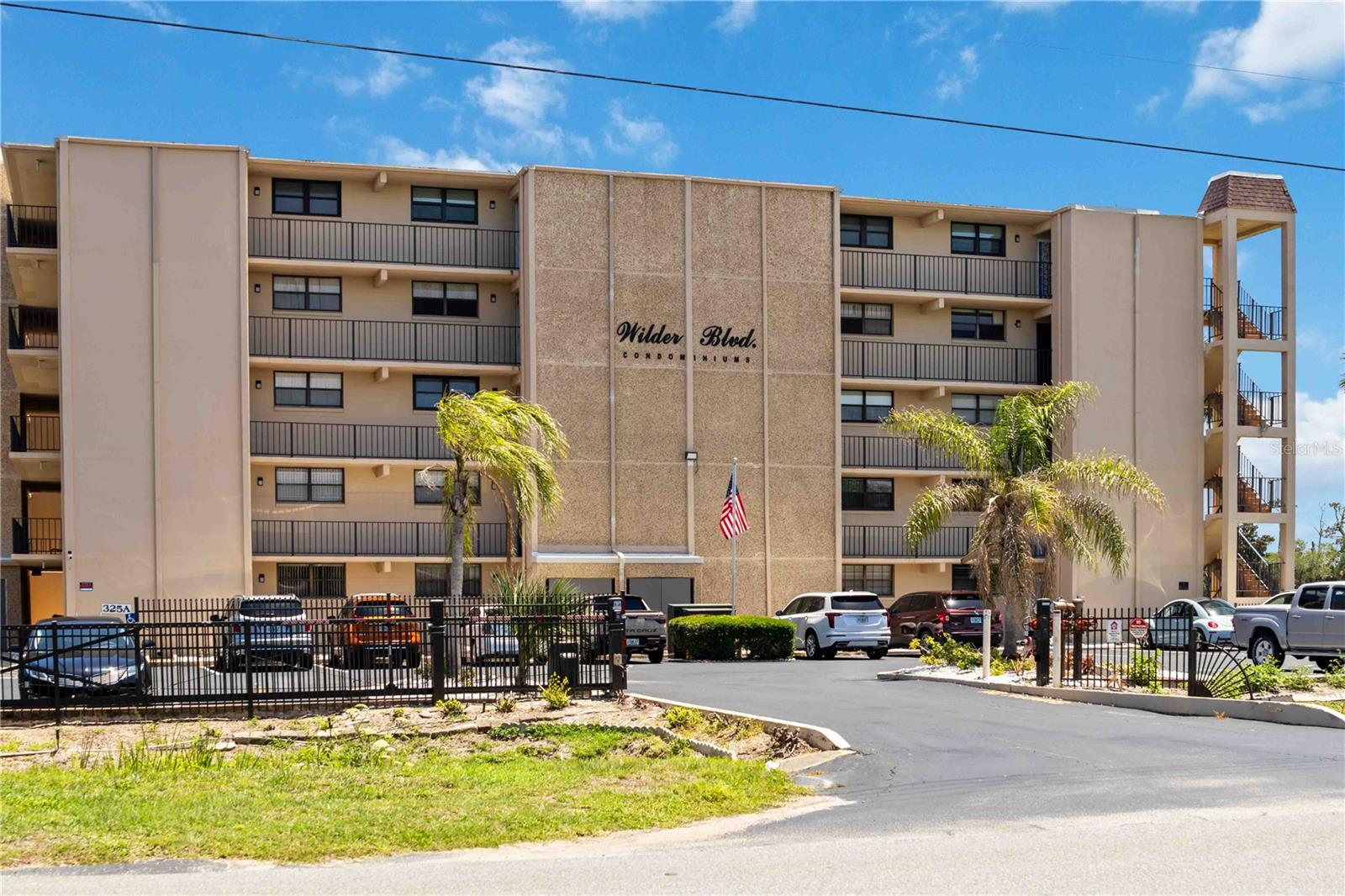 Welcome to this beautifully remodeled 2-bedroom, 2-bathroom top-floor corner unit in the desirable 55+ Golf’s Edge Condo community! Offering 1,056 square feet of thoughtfully designed living space, this light-filled condo combines comfort, style, and convenience in an ideal location. Remodeled in 2020, the home features a stunning open floor plan that seamlessly connects the kitchen, dining area, and living room, creating the perfect space for everyday living and entertaining. Beautiful tile flooring flows throughout the home, while crown molding adds an elegant touch to the main living areas. The kitchen is sure to impress with marble countertops, gorgeous cabinetry, and stainless steel appliances. The spacious living area is filled with natural light from the sliding glass doors that lead to the covered patio overlooking the pool and golf course, offering a peaceful setting to relax and unwind. The primary suite features an en suite bathroom with a shower and tub combination, while the secondary bedroom offers comfortable space for guests or a home office. Just outside the front door, you’ll find a private storage closet complete with your own washer and dryer for added convenience. Residents of Golf’s Edge Condo enjoy access to community amenities including a pool, shuffleboard courts, and golf course views throughout the neighborhood. Conveniently located just minutes from the beach, restaurants, shopping, Daytona Beach International Airport, I-95, and major roadways, this move-in-ready condo offers the perfect blend of low-maintenance living and coastal convenience. Don’t miss your opportunity to enjoy the Florida lifestyle in this beautifully updated home! Mortgage savings may be available for buyers of this listing.