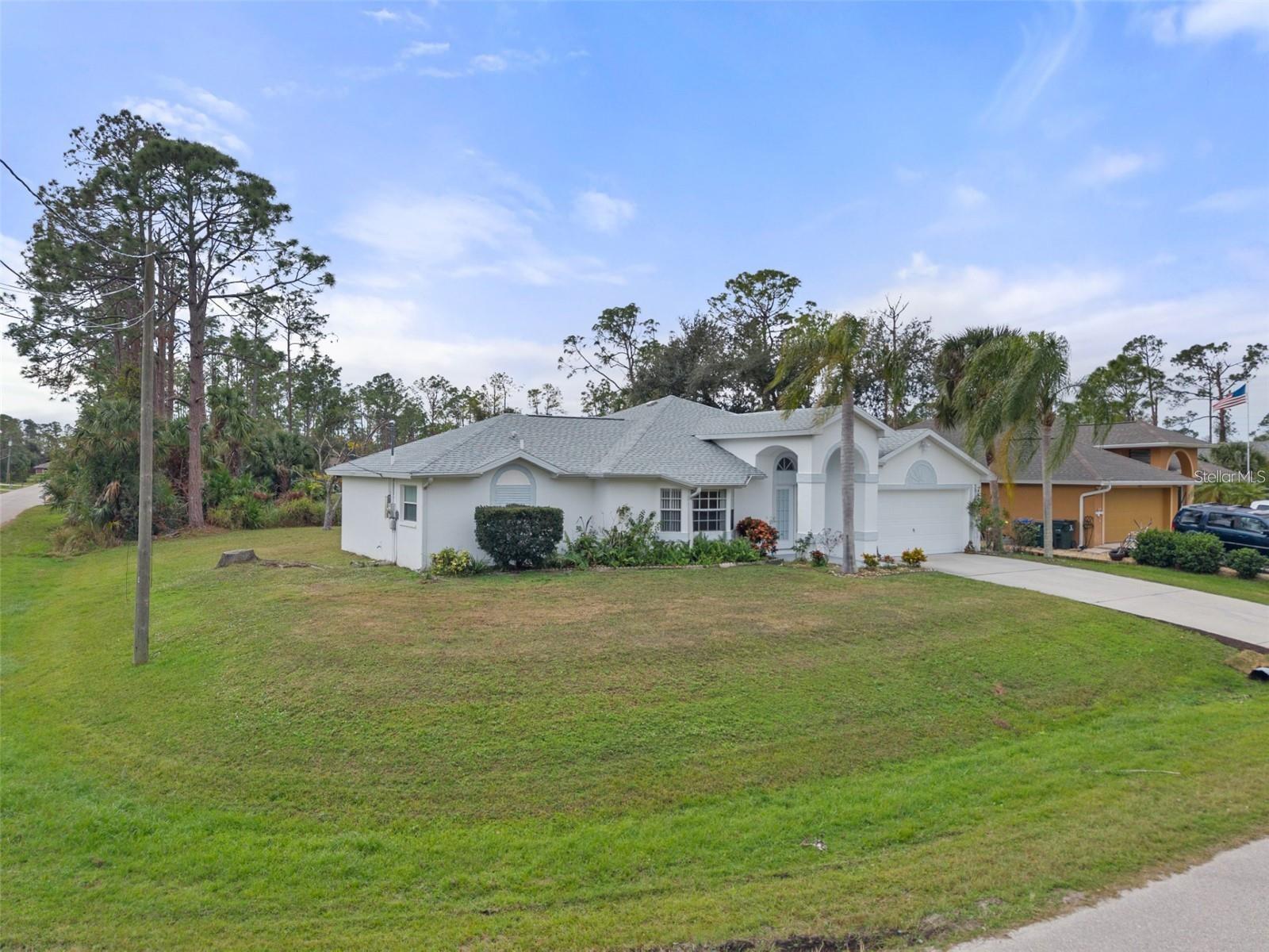 One or more photo(s) has been virtually staged. Move-in ready corner lot home with public water, nestled in a peaceful North Port neighborhood! Featuring a 2018 roof, this well cared for property offers comfort, durability, and long term value. The bright, open layout is perfect for everyday living and entertaining. Conveniently located near shopping, dining, schools, parks, and major highways, with easy access to Gulf beaches. Ideal for first time buyers, seasonal residents, or investors. A must see opportunity in one of North Port’s fastest growing areas.