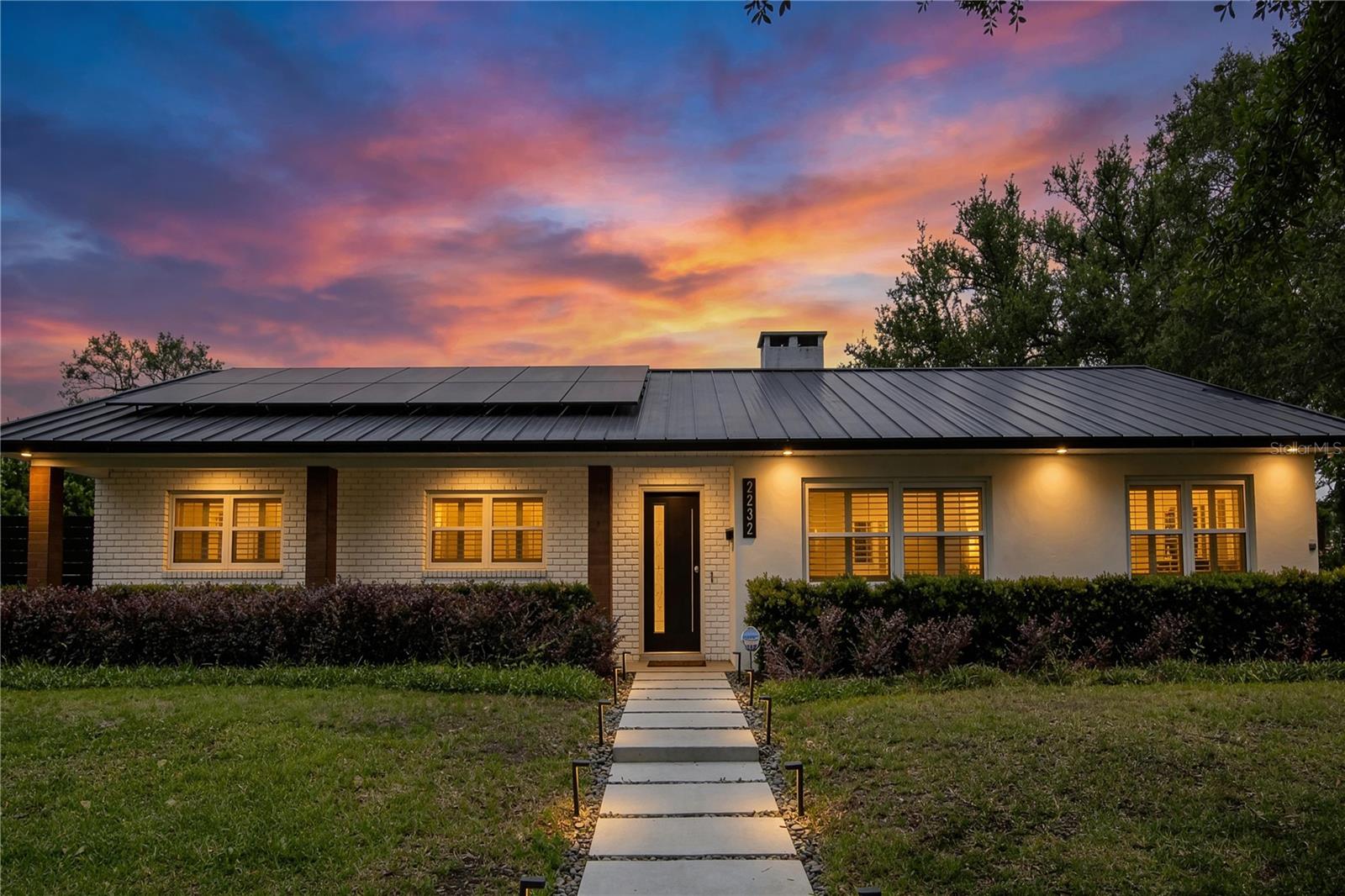 Step into the Winter Park lifestyle with a fully turnkey home designed to make daily living feel effortless. Set on an oversized corner lot, this fully updated home blends clean design with thoughtful upgrades.
Inside, the home is built to bring people together. The open-concept layout flows seamlessly from living to dining to kitchen, anchored by a striking 9-foot Carrera Thassos quartz island. A full KitchenAid black stainless steel appliance suite, generous storage, and refined finishes make this a space that works as well on a busy weekday as it does when hosting a full house.
Out back, everything is ready to enjoy. A private, resort-style setting features a saltwater pool with fire bowls, custom lighting, and a dedicated outdoor dining area, all framed by professionally designed landscaping and low-maintenance artificial turf. 
Beyond the aesthetics, this home delivers real, everyday value. A reverse osmosis system, fully updated electrical and plumbing, a 5-ton air conditioning system, and a metal roof provide peace of mind. An 18.4-kilowatt solar system keeps utility costs remarkably low, with many months producing surplus energy credits.
Located in sought-after school zones and just minutes from Cady Way Park, with easy access to Orlando, this is a home where everything has already been considered. No projects, no waiting, just move in and start living.
Buyer to assume $75,000 solar panel loan, offset by minimal to near-zero electric costs and ongoing energy credits during high-production months. Utility bills available on request.