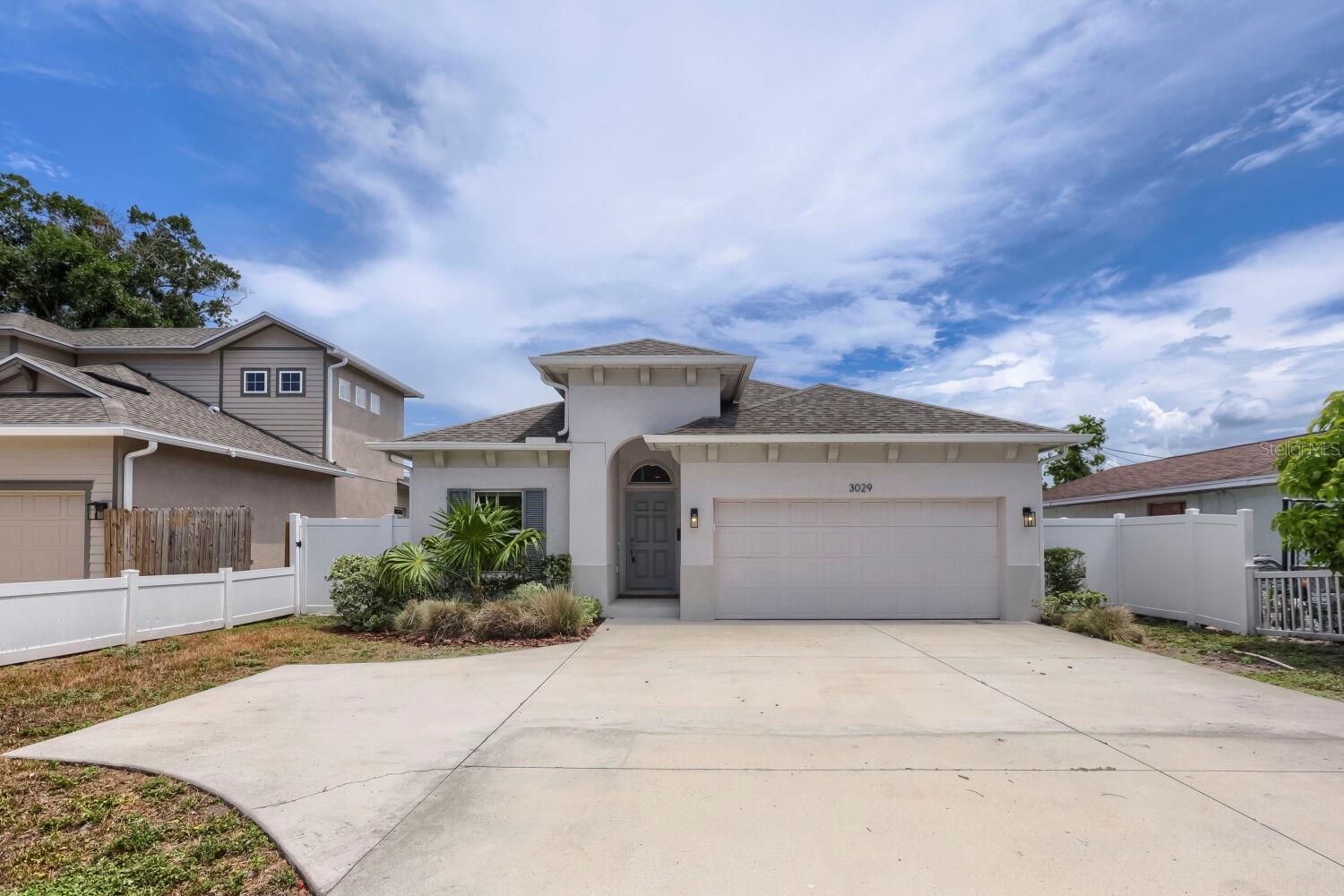 Welcome to this beautifully built 2023 home offering the perfect blend of modern design, comfort, and convenience! This spacious 3-bedroom, 2-bath residence features an open-concept floor plan with soaring ceilings, abundant natural light, and a stunning kitchen complete with a large center island, pantry, and breakfast area—ideal for entertaining and everyday living. The private primary suite boasts a walk-in closet, dual-sink vanity, and a peaceful location at the rear of the home. A dedicated office/den provides the flexibility to work from home, create a playroom, or enjoy a hobby space. Step outside to a fully fenced backyard with dual patios, perfect for relaxing or hosting family and friends. Conveniently located just minutes from downtown St. Petersburg, I-275, shopping, dining, and the airports, this move-in-ready home offers the best of Florida living in a prime central location.