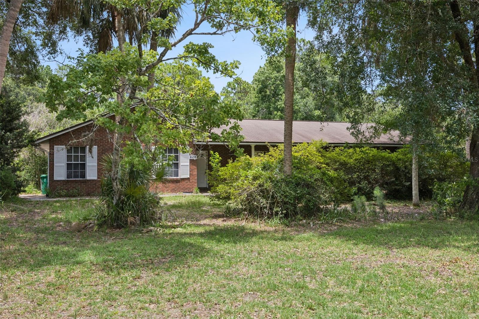 Located in the desirable Windover Farms, this spacious 4-bedroom, 3-bathroom home sits on a beautiful 1-acre lot and offers an incredible opportunity to make it your own. With over 2,700 square feet of living space, this property is full of potential and ideal for buyers looking for a renovation opportunity.

The home features a side-entry garage, formal living room, dining room, and a large family room with a cozy wood-burning fireplace. The oversized primary suite offers plenty of space, complete with an en-suite bath and walk-in closet. A desirable split floor plan provides privacy, with three additional bedrooms and two full bathrooms on the opposite side of the home. 

Enjoy outdoor living with a very large screened-in rear porch and a welcoming covered front porch. The gorgeous lot is shaded by mature trees, offering both beauty and privacy in a peaceful setting.

Bring your vision and transform this property into your dream home in one of Titusville’s most sought-after communities!  * Floor plan and virtual tour links attached