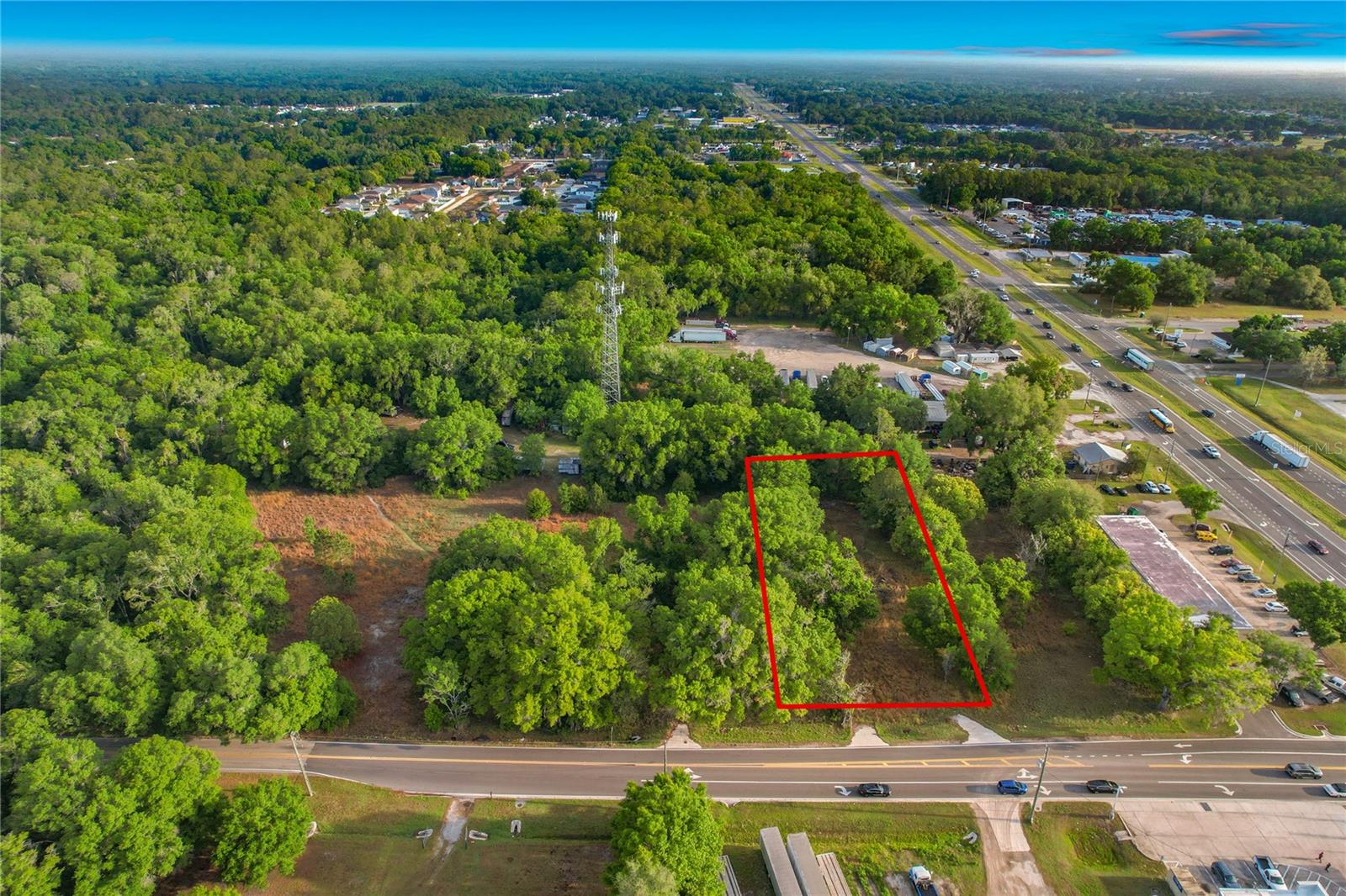 Prime 5.56 Acres | North Lakeland (33810) | Exceptional Frontage & Development Potential

Discover a rare land opportunity in one of Lakeland’s fastest-growing corridors. This 5.56-acre assemblage in North Lakeland includes three parcels (L4961354 - 0.70, L4961359 - 0.72, and L4961353 - 4.14 acres) being sold together—perfect for developers, investors, or anyone envisioning a private estate with room to grow.

Positioned just off US Highway 98 North, the property features 803 feet of prime frontage on Duff Road — delivering outstanding visibility, access, and flexibility for future use. With an approximate 300-foot depth, the layout supports a variety of residential or investment configurations. (Three lots - 593 feet plus 105 feet plus 105 feet for a total of 803 feet of prime frontage on Duff Road.)

Located in rapidly expanding North Lakeland, the site benefits from strong nearby residential, commercial and retail growth with an increasing demand for land. Quick access to I-4 connects you to Tampa, Orlando, and the broader Central Florida market—enhancing both commuter appeal and long-term value.

Key Highlights

5.56 total acres (3 parcels sold together)
803 ft frontage on Duff Rd 
Prime location just off US-98 N in North Lakeland (33810)
Utilities nearby (water & electric)
Ideal for residential, commercial, retail development, subdivision, private estate, or buy-and-hold
Close to shopping, schools, and major roadways
Whether you’re planning multiple homesites, a private compound, or a strategic land hold in a high-growth area, this property offers the scale, frontage, and location to bring your vision to life.

Lakeland’s continued growth makes this an opportune time to invest. Buyers are encouraged to verify zoning, land use, and development options with local authorities.