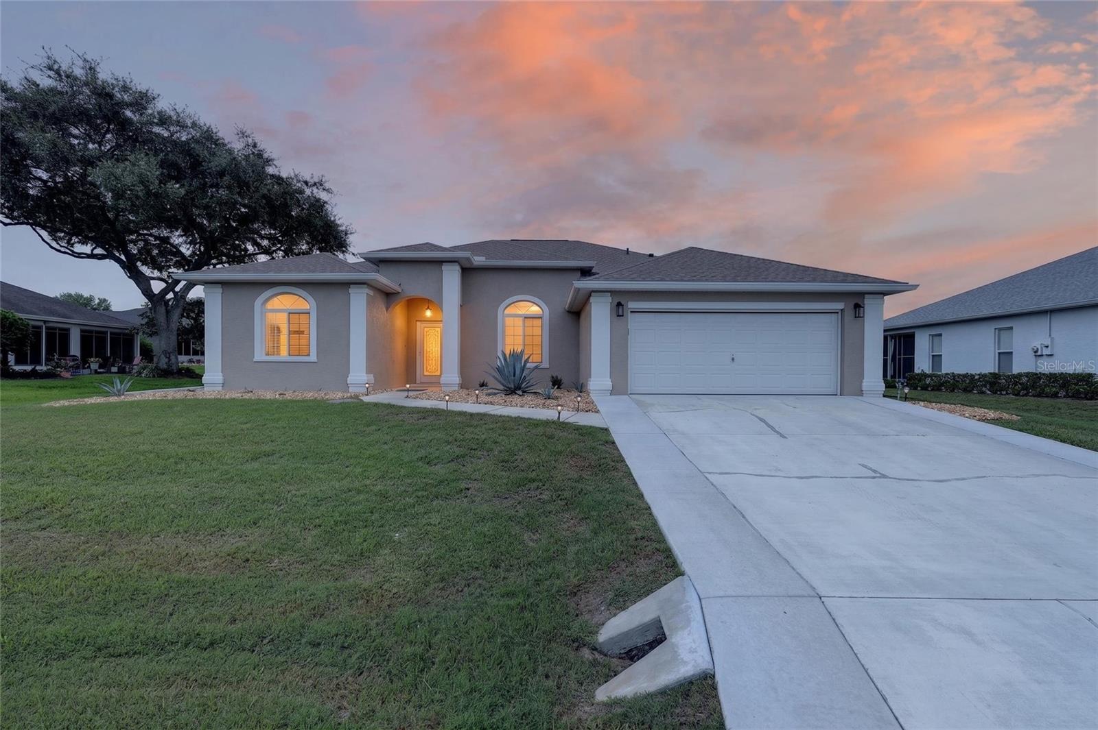 Move-In Ready Golf Course Home with Extensive Updates in Ocala Palms! 
Welcome to 5770 NW 21st Street, Ocala, FL, where quality, comfort, and peace of mind come together in one beautifully maintained home. Perfectly situated on the golf course, you’ll enjoy picturesque views, open green space, and the privacy that only this premium location can deliver. One of the greatest benefits of this home is that the major expenses have already been taken care of for you. Recent improvements include a new roof (July 2023), new central air conditioning system (August 2025), new water heater (June 2026), new carpeting (September 2023), new window blinds and curtains, new Whirlpool stainless steel kitchen appliances, new garbage disposal, and a new Whirlpool washer and dryer. The updates continue throughout the home with fresh interior and exterior paint, an epoxy-coated garage floor, widened driveway, beautiful river rock landscaping at the entrance, custom lanai roll-up shades, new lanai carpeting, storm door, programmable lighting, recessed LED lighting, updated switches, receptacles, cover plates, new backyard motion security lighting, brushed nickel bathroom fixtures, new faucets, showerheads, control valves, towel bars, accessories, and upgraded 4½-inch pine baseboards with freshly painted interior doors, trim, and updated door hardware. Inside, you’ll appreciate the bright, open floor plan that seamlessly connects the living room, kitchen, and dining area, creating the perfect space for entertaining or relaxing. The kitchen overlooks the living area, allowing you to enjoy conversations or watch television while preparing meals. The dining area is enhanced by a charming bay window that fills the space with natural light. The spacious primary suite features an elegant tray ceiling and offers plenty of room for a king-size bedroom set with additional furniture. Every room reflects the exceptional care this home has received—it’s truly neat as a pin and move-in ready. Located in the highly desirable Ocala Palms golf community, you’re just minutes from the clubhouse and an outstanding selection of amenities including an indoor heated pool, Olympic-style outdoor swimming pool, tennis courts, bocce ball, shuffleboard, fitness center, and an active social calendar. Convenience is unmatched with the World Equestrian Center only 1½ miles away. Shopping, dining, Publix, Walgreens, Gold’s Gym, and numerous restaurants are just outside the community entrance. Plus, you’re approximately 90 minutes from Orlando’s world-famous attractions including Disney World, Universal Orlando, SeaWorld, EPCOT, LEGOLAND Florida, and Orlando International Airport. If you’re looking for a meticulously maintained home where the costly updates have already been completed, exceptional golf course views, and an unbeatable location, this home deserves a place at the top of your must-see list. Schedule your private showing today!