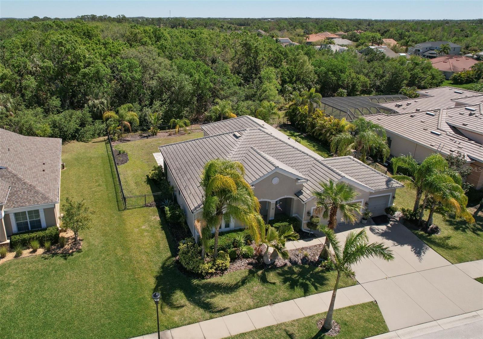 Virtually Staged. Welcome to 5409 Conch Shell Dr, a beautifully maintained one-story, 4-bedroom, 2-bathroom home that offers spacious living and the ultimate Florida lifestyle. A/C (2021), water heater (2024), and gutters, this residence features high ceilings, elegant tile flooring, a formal dining room, and upgraded light fixtures. The granite kitchen includes stainless steel appliances, ample cabinetry, and a comfortable dining area ideal for everyday living and entertaining. The luxurious primary suite boasts dual walk-in closets, double vanities, a soaking tub, a separate walk-in shower, and serene conservation views. Triple sliding doors open to a large screened area and paver patio, complemented by a storage shed and a fully fenced backyard. Situated on a quiet cul-de-sac and spanning just over a quarter acre, the property provides exceptional privacy and generous outdoor space. Harbour Isles is a resort-style amenities such as a pool and spa, fitness center, basketball and volleyball courts, playground, walking trails, fishing pier, and a boat/RV parking. Conveniently positioned just minutes from I75, US-41, the new Walmart, Publix, a variety of dining and shopping options, as well as Little Harbor and the Apollo Beach Preserve, this home offers a perfect blend of comfort, style, and exceptional convenience in one of the area’s most desirable locations. Furniture is negotiable.