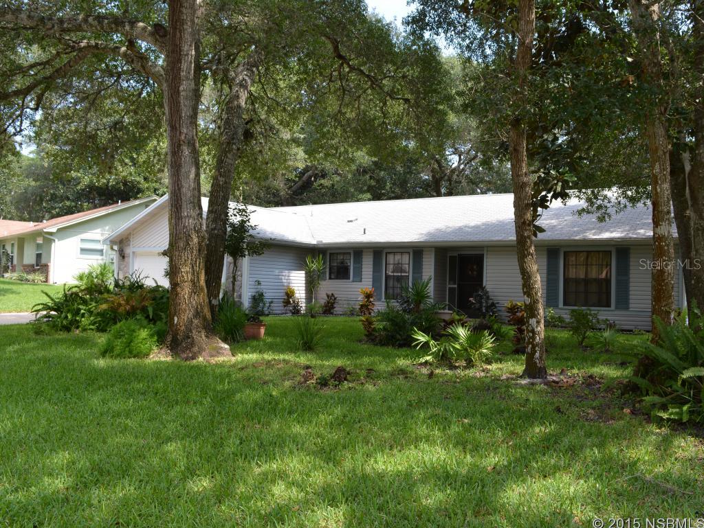 Curb appeal and a wonderful floor plan in the desirable Northbrook neighborhood where homes are well maintained yet NO HOA. Bright entryway to your eat in kitchen. Welcome your guests into the huge great room with vaulted ceilings and wood beams and is graced with a (decorative only) fireplace and new carpeting. This home offers a split floor plan to offer plenty of privacy in the 2 large guest rooms. A covered and screened lanai for outside dining and looks out into your fenced back yard. Over sized inside laundry. HVAC new in 2015, water heater 2014, newer garage door and lighting and transferable termite bond. Easy access to great schools, shopping the Halifax River and the beaches. ;Water: City