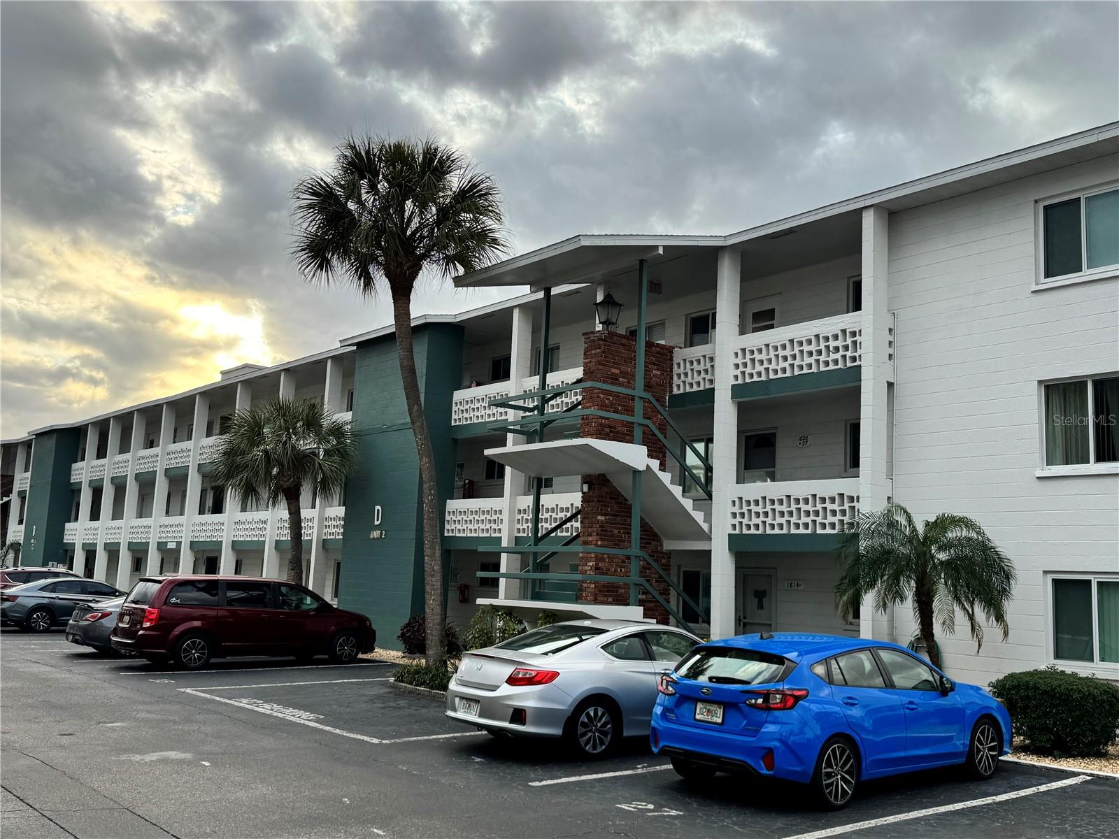SELLER CREDIT TOWARD NEW FLOORING, and NEW PAINT! MOVE-IN READY, FULLY FURNISHED and lots of NATURAL LIGHT, this one-bedroom, one-bath condo offers comfort, style, and peace of mind. Enjoy the Florida room featuring HURRICANE-IMPACT WINDOWS and serene views overlooking lush palm trees. The recently UPDATED BATHROOM includes a WALK-IN SHOWER with a modern sliding glass door, updated high-rise toilet, vanity, and faucet. The UPDATED KITCHEN offers ample storage, an added pantry, Silestone countertops, and a NEW energy-efficient refrigerator. Additional features include UPDATED WINDOWS, mirrored hall closet doors, and three baseboard heaters connected to a central hall thermostat. The Heat and A/C system thermostat is centrally located for year-round comfort coupled with the Humidistat control system. A steel entrance door with an aluminum storm door adds extra security and durability. FUN 55+ COMMUNITY with POOL, SHUFFLE BOARD, LAUNDRY, SIDWALKS throughout the court yard for early morning walking. Great location close to shopping, restaurants, 20 minutes to the BEACH, 10 minutes to SRQ International Airport. Ideal for full-time living or a seasonal retreat.