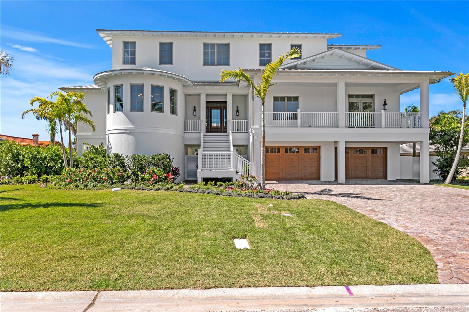 Welcome HOME to Bayway Isles – a coveted and premier waterfront community in St. Petersburg! Featuring another rare opportunity to buy luxury NEW construction from one of St. Petersburg’s custom home builders, Coastline Development! Showcasing a coastal simplistic design, this home is welcoming yet elegant in style. Spanning nearly 4600 SFT, the home will feature 4 bedrooms, 3 full baths, 2 powder (half) baths, dining room, office, bonus (flex) space, 3 car finished garage, wood & gas burning fireplace, 3-stop elevator, front and rear porches, custom pebble tec pool & spa, and so much more! The ground level features a spacious 3 car garage, mud room, and a breezeway connecting two additional storage areas - which could be perfect for a future yoga studio or simply overflow storage. Upon entering, you will have a stunning open concept connecting the living, dining, and kitchen spaces. The living room is divine with its volume ceilings that showcase a custom coffered design. The cozy fireplace, with a sleek plaster finish, adds warmth during the cool winter months and charm to the overall space. The gourmet kitchen is the heart of the home and will feature custom wood cabinetry, leathered Michelangelo countertops, Thermador Fridge and wine cooler, Bosch dishwasher, Ilve range, and beautiful double kitchen islands. Also located on the 2nd level is a powder bathroom, spacious laundry room, and the office space which features a white oak wood beam ceiling detail and a beautiful water view. In fact, multiple rooms throughout this coastal home offer magnificent water views. Second level primary retreat as well which offers another beautiful coffered ceiling design with wallpaper detail, two private balconies, and a luxurious bathroom with walk in closet systems, his & her vanities, free standing clawfoot tub, and a walk-in glass shower enclosure. As you move upstairs to the 3rd level, this floor will offer 3 more bedrooms, one of which has an en-suite bathroom, and the other is a jack and jill arrangement. The expansive bonus room and lovely 2nd powder bath is also located on this floor. This bonus space is the perfect relaxing or entertaining area offering again beautiful views of the water including the Sunshine Skyway and Indian Key Nature Preserve. Exterior design elements to include but not limited to solid block construction, metal roof, Hardie Boys custom rafter tails, Kolbe impact rated windows with wood clad interior frames, custom metal gates, luscious landscaping, block privacy wall,  old Carolina savannah gray brick papered driveway, coral stone deck material, IPE stairways, and Canyon Ridge garage doors. Interior design elements will showcase beautiful luxury engineered wood flooring, custom wood ceiling treatments, high level millwork on windows & doors, level 5 smooth texture, Icynene spray foam insulation, 24 SEER Carrier GreenSpeed HVAC Systems, decorative light fixtures throughout, and so much more! Conveniently located to award winning Gulf Beaches and minutes to vibrant Downtown St. Petersburg featuring shops, dining, museums, St. Pete Pier, and so much more. Easy access to I-275 and Tampa International Airport. Residents also enjoy the Bayway Market which is a short stroll or bike ride ideal for grabbing produce, artisanal goods, fresh cut meat or seafood, or daily essentials. Schedule your personal tour today for this remarkable home!