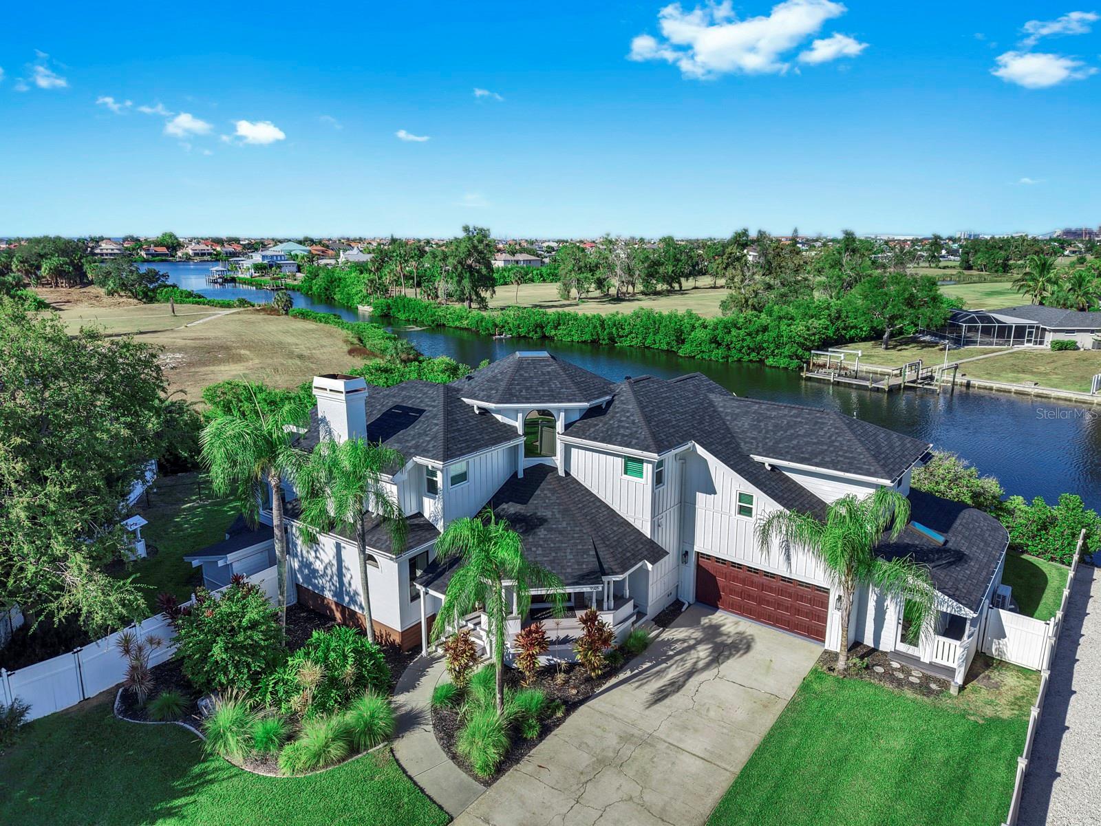 CUSTOM WATERFRONT ESTATE with 236 FT of FRONTAGE + DIRECT ACCESS to TAMPA BAY! Experience a one-of-a-kind coastal retreat designed for luxury, privacy, and effortless Florida living. This custom-architected home sits on an oversized lot with 236 ft of water frontage, offering immediate access to Tampa Bay—be on the bay in minutes. Inside, nearly 3,400 sq ft of light-filled space features 4 bedrooms, 3.5 baths, and refined coastal design throughout. The layout blends elegance and comfort with engineered wood floors, vaulted ceilings, and new hurricane-impact windows showcasing sweeping waterfront views. Step outside to your private paradise: pool, hot tub, outdoor kitchen, fire pit, multiple lanais, fenced yard, and a private dock with boat lift. Whether entertaining or unwinding, every moment here feels like vacation. For the modern professional, a separate 200 sq ft air-conditioned office with its own entrance provides the perfect setup for business owners or remote work. An oversized 2-car garage and rare Florida basement add convenience and storage flexibility. No HOA or CDD fees—just pure waterfront freedom. This is Apollo Beach living at its best—a private, custom-built escape where architecture, lifestyle, and location come together seamlessly, creating a feeling you simply can’t capture in photos Every day here feels like coming home to your own private vacation retreat. Schedule a showing to experience it for yourself.