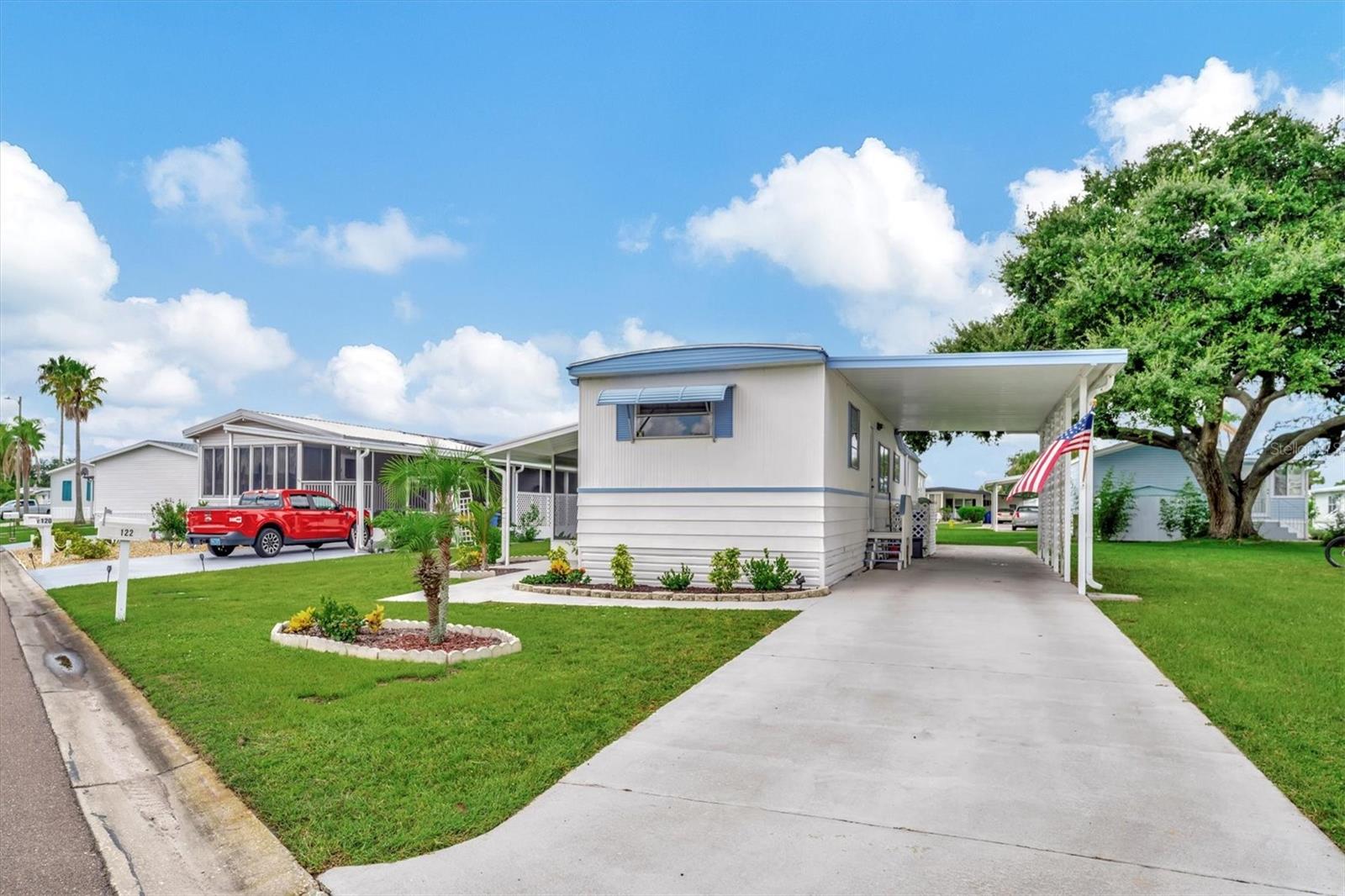 Welcome to Caribbean Isles Residential Cooperative, a friendly 55+ gated waterfront community located in the heart of Apollo Beach, Florida. One of the many benefits of living in Caribbean Isles is no CDD and no lot rent, along with a low monthly maintenance fee.

This move-in ready, furnished 2-bedroom, 1½-bath home features updated flooring and a new roof, making it easy to settle in and start enjoying the Florida lifestyle right away. Relax with your morning coffee or evening breeze in the comfortable screened-in room, a perfect space to unwind.

If you enjoy the outdoors, you’ll love our kayak and boat launch facilities, with a scenic canal system that offers direct access to Tampa Bay. For those who enjoy friendly competition, the community features bocce ball, shuffleboard courts, and horseshoes. The heated community pool is open year-round, perfect for relaxing or socializing with neighbors.
Inside the clubhouse, residents enjoy a craft room and a large game room complete with pool tables, card tables, indoor bar shuffleboard, and darts. Caribbean Isles offers an active social calendar with themed dinners, dances, and community events throughout the year, creating plenty of opportunities to connect with friends and neighbors. Ideally located between Tampa and Sarasota/Bradenton, you’ll have convenient access to beautiful Gulf beaches, shopping, dining, entertainment, and world-class attractions.
Come see for yourself why so many love calling Caribbean Isles home.