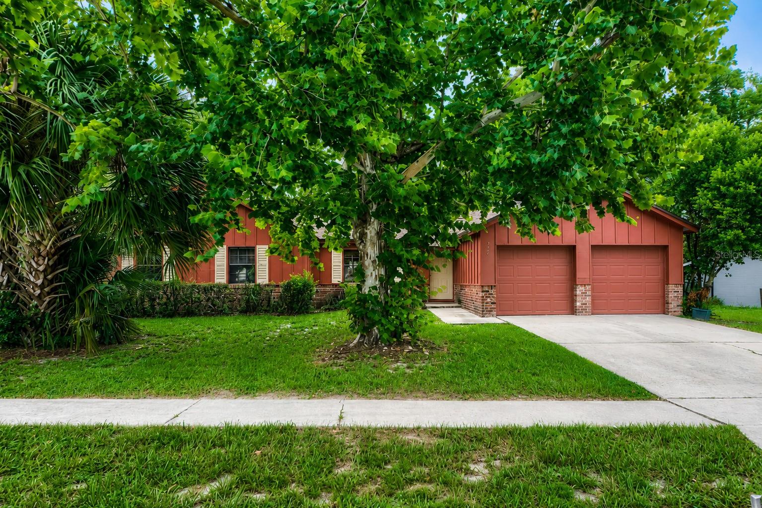MOVE-IN READY HOME on an amazing 0.3-acre corner lot! In the heart of Seminole County's Winter Springs lies your future home. This warm, cozy yet spacious home with an oversized primary bedroom and wood-burning fireplace will make you fall in love. The dining area flows into the kitchen and then into the family room, overlooking a sweeping backyard that's perfect for indoor-outdoor living. Fresh interior paint and new flooring enhance the home's appeal. Additional highlights include a spacious 2-car garage and access to highly regarded Seminole County schools. Conveniently located near major highways, shopping, dining, and parks, this home offers a blend of comfort and convenience. Schedule your showing today.