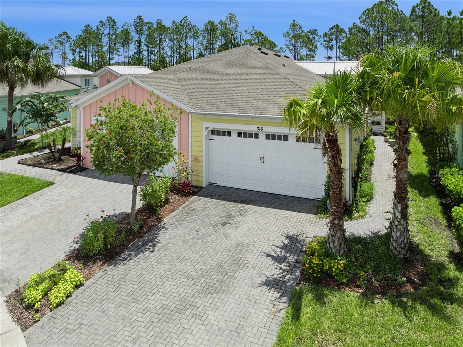 Experience RESORT style living every day in this BEAUTIFUL Antigua model located in the HIGHLY sought after 55+ GATED community of Latitude Margaritaville Daytona Beach. Inspired by the laid back lifestyle and music of Jimmy Buffett, this VIBRANT community offers the perfect blend of LUXURY, FUN, and LOW MAINTENANCE living.
This light filled home features two spacious bedrooms, two full bathrooms, PLUS a versatile DEN that can easily serve as a home office, hobby room, or third bedroom. With more than 1,500 square feet of thoughtfully DESIGNED living space, you’ll appreciate the OPEN floor plan, SOARING ceilings, recessed lighting, and stylish finishes throughout.
The KITCHEN is the centerpiece of the home, offering a large QUARTZ island that’s perfect for gathering with family and friends. Additional highlights include 42-inch CABINETRYywith crown molding, a beautiful tile BACKSPLASH, stainless steel appliances, pull out shelving, and abundant storage. The SPACIOUS LIVING ROOM opens seamlessly to the screened lanai, creating the perfect indoor and outdoor living experience. Enjoy peaceful WOODED views while relaxing with your morning coffee or entertaining guests in your PRIVATE BACKYARD RETREAT. The primary suite is generously sized and overlooks the tranquil conservation area. The ensuite bathroom features a FRAMELESS glass shower, and a large WALK-IN closet. Attractive wood look laminate flooring runs throughout the main living areas, providing both style and easy maintenance.
Life at Latitude Margaritaville is unlike anywhere else. Residents enjoy a spectacular RESORT STYLE POOL with a beach entry, tiki huts, the state of the art Fins Up! FITNESS CENTER with a spa and indoor lap pool, championship PICKLEBALL and tennis courts, a bark park, pet spa, hobby rooms, and an on site barbershop. Take your GOLF CART to the lively Town Square for nightly entertainment, enjoy lunch at Latitude Bar and Chill, or simply soak in the incredible lifestyle this community is known for.
Convenience is another bonus with a Publix shopping center just outside the entrance, easily accessible by golf cart or bicycle. Residents also enjoy EXCLUSIVE ACCESS to a PRIVATE OCEANFRONT BEACH CLUB with shuttle service, making beach days effortless.
If you’ve been dreaming of a home where every day feels like a vacation, this is your opportunity. Schedule your private showing today and discover everything this exceptional home and community have to offer.