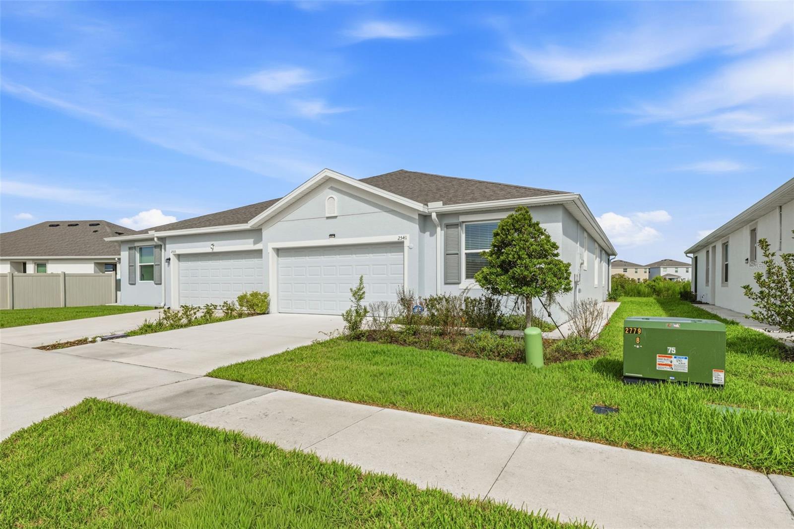 WELCOME HOME! Beautifully maintained 3-bedroom, 2-bathroom villa tucked into the sought-after Woodcreek community in the heart of Wesley Chapel. Built in 2024 with durable concrete block construction on both stories, this 1,565-square-foot home offers an open floor-plan complemented by extended tile in the main living and dining areas, granite counter-tops, screened in porch and a stainless-steel appliance package, combining low-maintenance living with a fresh, move-in-ready feel. A 2-car attached garage and irrigation system round out the practical, everyday conveniences. Home is also fully handicap accessible with bars installed in all the restrooms.

Woodcreek's amenity package makes everyday living feel like a vacation. Residents enjoy access to a sparkling community pool with shaded lounge areas and pergola-covered seating, a covered pavilion with picnic tables perfect for family gatherings, and a nearby playground for the all to burn off energy on a sunny Florida afternoon.
Location is everything, and this one delivers. Just off SR-56, homeowners are minutes from Wiregrass Mall's shopping and dining, think Grill Smith, Red Robin, and Noble Crust, plus Tampa Premium Outlets and Main Event Entertainment, all about 15 minutes from I-75. Everyday errands are effortless with Target and Publix close by, and healthcare is never far with both St. Joseph's and AdventHealth facilities minutes from the neighborhood.

Woodcreek is zoned for Double Branch Elementary School, Dr. John Long Middle School, and Wiregrass Ranch High School, a strong, well-regarded lineup within the Pasco County school district.