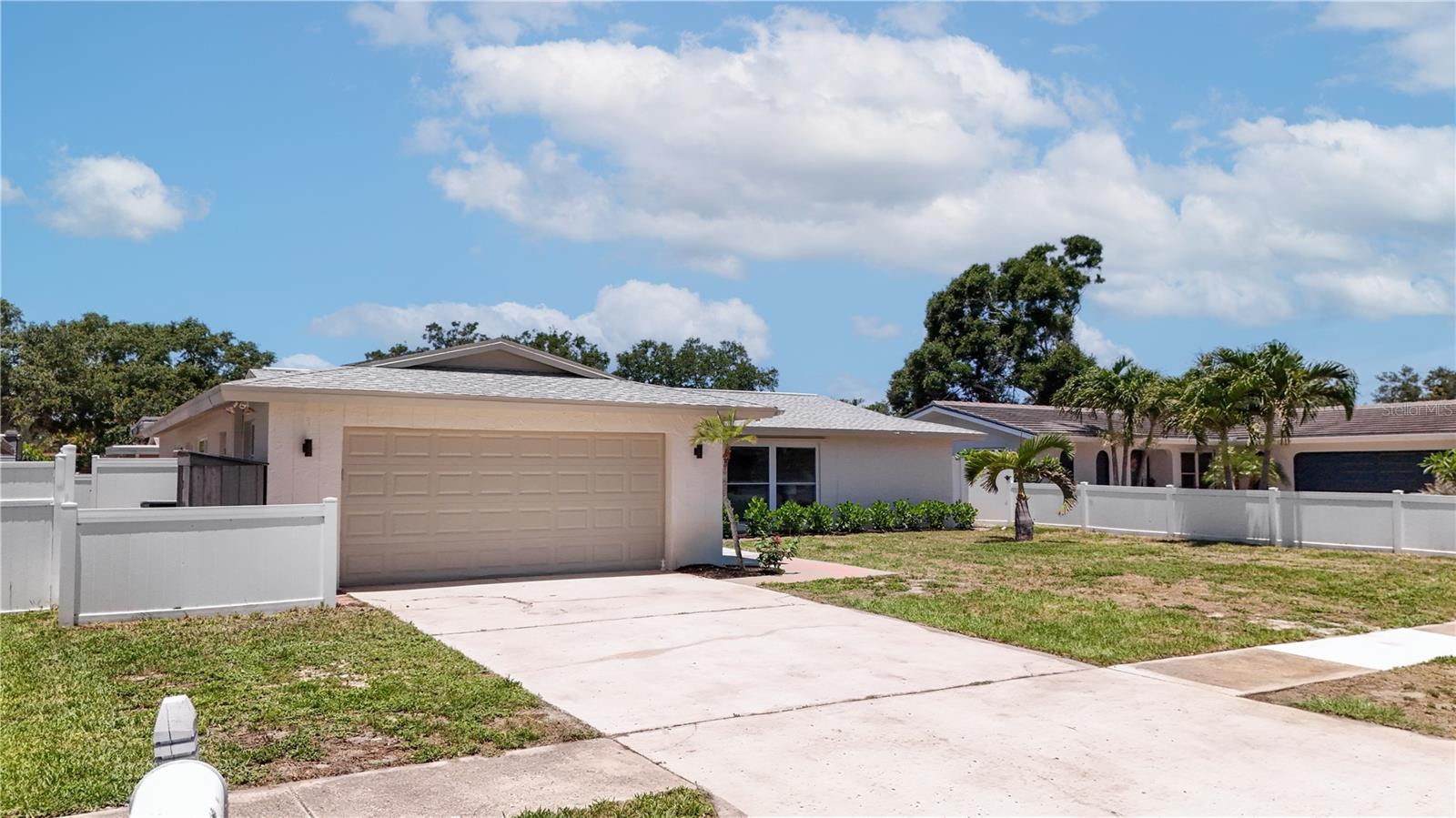 Sunshine, space, and a sparkling pool come together in this beautifully maintained 3-bedroom, 2-bathroom, 2-car garage home in the heart of Largo! A large light-filled living room welcomes you inside and flows seamlessly into the dining area and spacious eat-in kitchen, featuring stainless steel appliances, custom cabinetry, quartz countertops, a stylish backsplash, recessed lighting, and plenty of room for gathering with family and friends. The generous primary suite offers dual closets and a private en-suite bathroom with a walk-in shower, while the additional bedrooms provide flexibility for guests, a home office, or hobbies. An inside laundry room adds everyday convenience. Step outside to your own backyard retreat, complete with a screen-enclosed in-ground pool, fenced yard, and ample space to relax or entertain year-round. Located in a desirable non-flood zone, this home is just minutes from Walsingham Park, the Florida Botanical Gardens, Indian Rocks Beach, Largo Golf Course, John S. Taylor Park, shopping, dining, and entertainment. Whether you're looking for a full-time residence or the perfect Florida lifestyle, this home checks all the boxes, schedule your private showing today before this exceptional opportunity is gone!