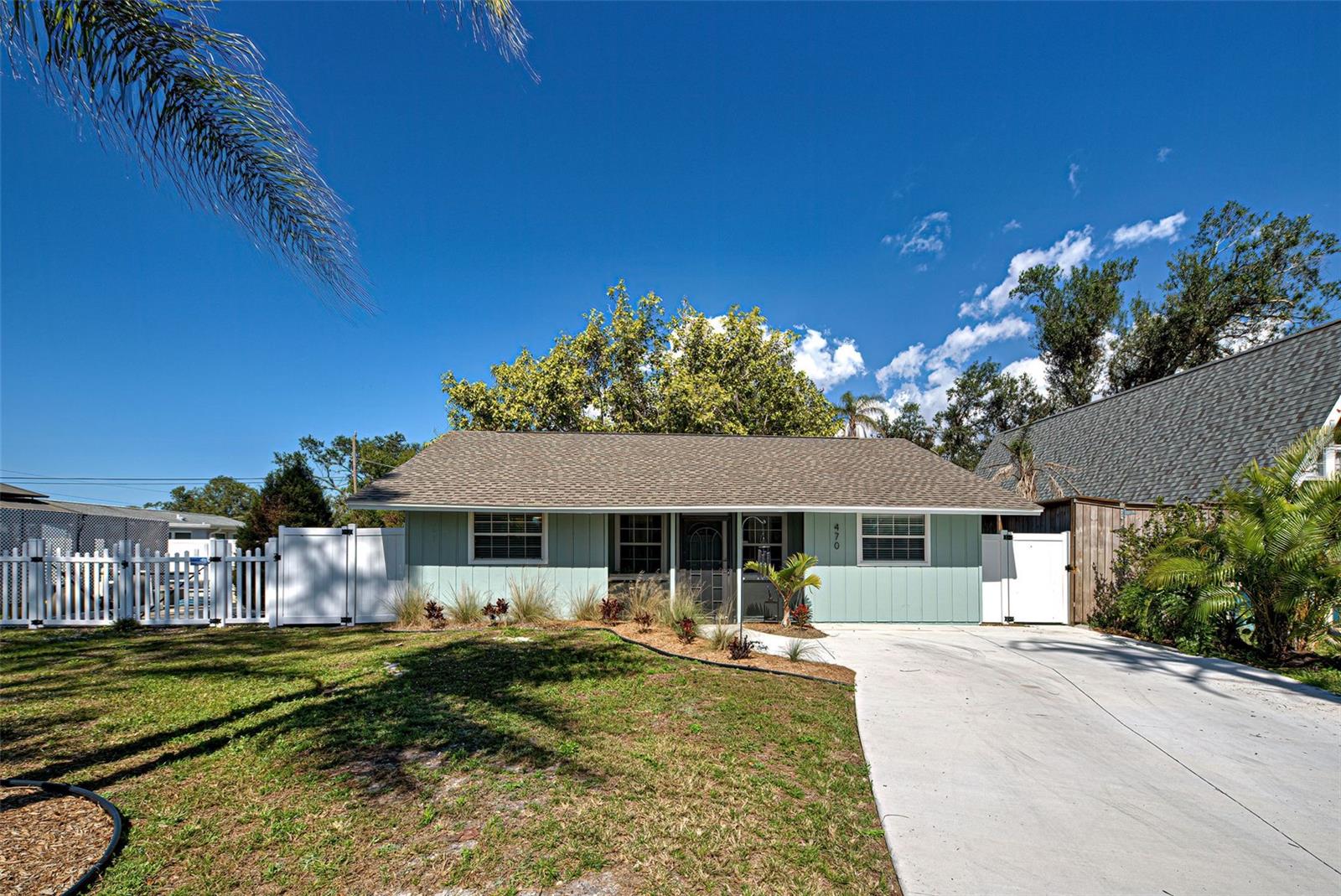NEW PRICE!  You absolutely must see this adorable property!  Charming cottage style 3-bedroom home with more space than you can imagine.  Don’t let the square footage deter you.  This gem offers an ample living room, cozy kitchen and dining area, 3 full bedrooms, 2 bathrooms, a mud room, and not one but two bonus rooms!   A spacious covered screened lanai overlooks a huge privately fenced back yard with ample room for a pool.  Enter through a cozy screened front porch to the living room with two windows flooding the area with natural light.  An open concept floor plan provides dining adjacent to the kitchen.  The kitchen features raised panel cabinets, granite countertops, new stainless appliances, and faucet.  Enter the first bonus room through charming French doors and let your imagination roam to the multitude of uses for this space.  The primary bedroom boasts new carpet, sliding glass doors leading to the screened lanai and French doors leading to the bonus room.  The main bath has been updated with a new vanity, mirror, commode, faucet, shower head, resurfaced shower tile and luxury vinyl flooring.  The guest bath has a new shower, vanity, commode, and flooring.  The second bonus room situated at the back of the house provides privacy, perfect for a home office, fitness room or playroom and features new luxury vinyl flooring.  A large laundry closet leads you to the mud room where you’ll find plenty of additional space for storage.  The third bedroom has a walk-in closet and new LV flooring as well.  In addition to everything this home also offers a new roof in 2023, new AC in 2018 with all new ductwork replaced in 2024, new insulation in the attic, new concrete driveway, new exterior, and interior paint.  Perfectly located just minutes to Dearborn St. with its charming ambiance, quaint shops, and dining venues.  Close to beaches and shopping. You’ll love to call this your new home!  A GREAT VALUE FOR UNDER $300,00!