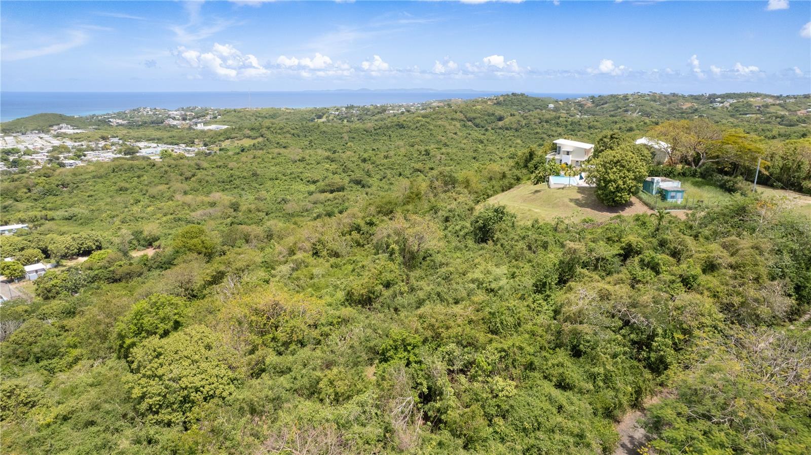 Located in the heights of the quiet, mid-island neighborhood of Los Chivos, this 3.4-acre lot offers elevated ocean views along with an exceptional sense of space and privacy.

The property presents strong development potential. Its topography and scale support flexible design options, from a luxury private residence to a cohesive residential community, with many lots positioned to capture both sunrise and sunset views. An approved segregation plan allows for division into 10 parcels, making it especially attractive for investors to efficiently execute a development vision. This is an ideal opportunity in a market with high demand for view-oriented and accessible properties.

Centrally located, the property offers convenient access to Isabel II for everyday essentials, as well as the island’s most sought-after destinations—including pristine Caribbean beaches, the world-renowned bioluminescent bay, and Esperanza’s established dining and tourism corridor—enhancing its appeal for full-time residents, vacation homeowners, and short-term rental markets.

Whether you are looking to build a private retreat or pursue a strategic development opportunity in one of Vieques’ most desirable areas, the combination of scale, views, and privacy undoubtedly makes this property a captivating option.