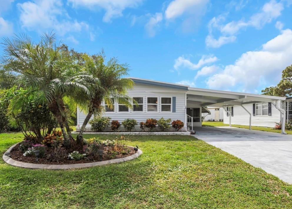 Welcome to the Village of Lake Tarpon, a 55+ community directly on Lake Tarpon with an extremely diverse choice of activities to participate in! And enjoy a beautifully updated unit, spacious at 1416 square feet. 4 year old roof, brand new extra large carport, All updates done within the last 4 years so nothing for you to worry about but where you'll put your furniture. Updated kitchen and baths, flooring and even a new power panel. Enjoy an evening stroll to the dock, meander over to the clubhouse for card games, crafts, club meetings or one of their many events. It's high class living where you own the land and can arrange your own gardens if you choose. Your family may complain that you're too busy to allow them to visit!