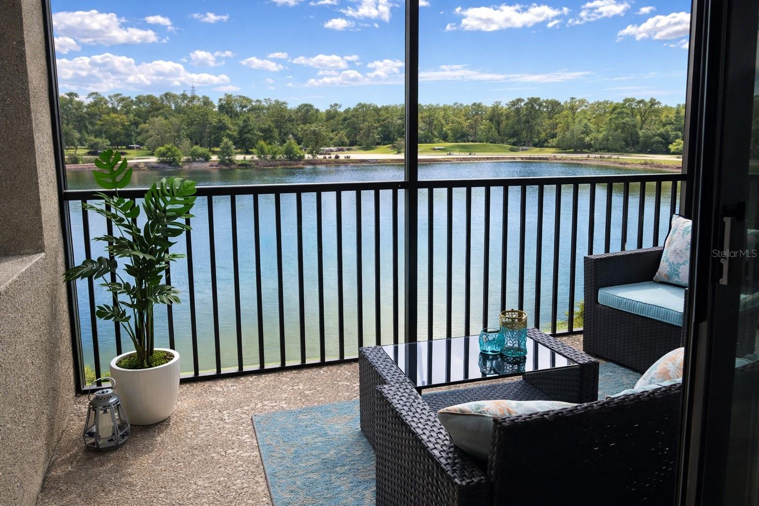 This beautifully furnished 2-bedroom, 2-bath condo in Lakewood National offers a perfect mix of luxury, comfort, and stunning views. Located on the third floor, the private screened lanai overlooks expansive golf course and lake scenery, providing a tranquil setting for morning coffee or evening relaxation. Built in 2017 and offered fully furnished, the light-filled interior features an open layout, elegant crown molding, and a stylish kitchen with granite countertops, stainless steel appliances, and ample cabinetry. The spacious primary suite includes dual closets and a modern en-suite bath with a walk-in shower, while the guest bedroom and full bath provide comfortable accommodations for guests. With covered parking, in-unit laundry, and a worry-free location outside flood and evacuation zones, this condo offers both convenience and peace of mind. Located within the gated Lakewood National Golf Club community, residents enjoy world-class amenities including two world-class Arnold Palmer-designed golf courses, a resort-style pool and spa, tiki bar, clubhouse dining, tennis, pickleball, a fitness center, and more. And for investors, this is resort-style living paired with an excellent investment opportunity.  Not only fully furnished, but fully equipped as a move-in ready resort getaway. Whether you're searching for a full-time residence, seasonal getaway, or income-producing property, this condo offers the ultimate Florida lifestyle.