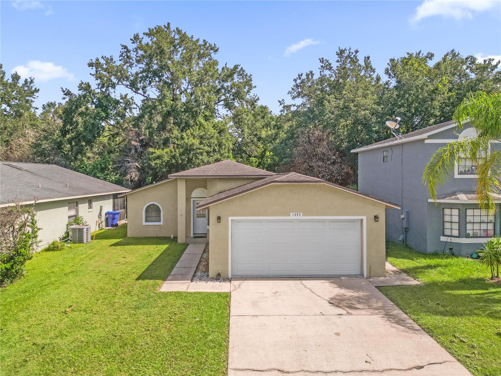 Virtually Staged. Rare DOUBLE primary suite floor plan! Beautifully updated 2-bedroom, 2.5-bath home backing to CONSERVATION on a quiet dead-end street with a fully remodeled kitchen, no carpet, NO HOA and MAJOR SYSTEM UPDATES. ***2017 ROOF, 2017 AC, 2025 PEX plumbing repipe, and a 2026 WATER HEATER***Both generously sized bedrooms feature their own private en-suite bathrooms, making this home ideal for guests, roommates, or multigenerational living. The completely remodeled kitchen is the CENTERPIECE of the home, offering modern cabinetry, updated finishes, ample counter space, and a cozy eat-in dining area. Fresh interior paint, abundant natural light, and uniform tile flooring throughout mean there is no carpet anywhere in the home. The updated half bath adds convenience for guests. Step outside to a beautifully paved patio overlooking the conservation area—the perfect space to relax or entertain while enjoying added privacy. Conveniently located with quick access to Florida's Turnpike, Orlando International Airport, Lake Nona Medical City, shopping, dining, and everyday conveniences, this move-in-ready home offers the perfect combination of thoughtful updates, low-maintenance living, and an exceptional location.