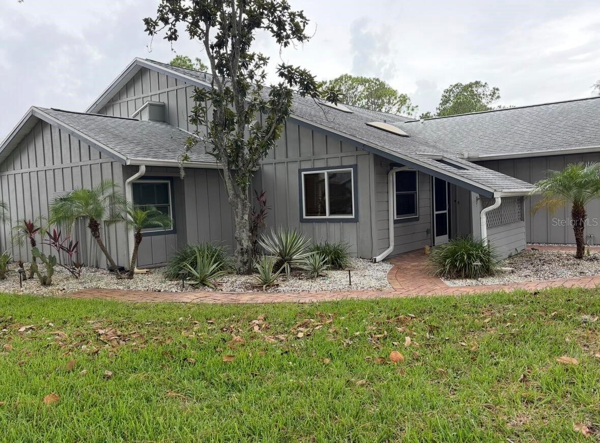 Welcome to this beautifully renovated 3 bedroom, 2 bath, 1 car garage condominium in charming Tarpon Springs, Florida. This residence lends itself to a comfortable living space, appropriate for those seeking a relaxed and convenient lifestyle. Situated in a well-maintained complex, this unit boasts many upgrades including a DREAMY kitchen, Bosch double wall oven, quality appliances, imported Granite counter tops, beautiful cedar beams, a coffee bar, recessed electric fireplace (surrounded by Eldorado Stone) and awesome fans and lighting...The master suite boasts a walk in closet, shower and a double vanity. New carpet lays in the large second bedroom and has a lot of closet space. New LVP runs throughout the rest of the house giving it visual appeal and a clean, neat look. Skylights in both the front bedroom and living room providing natural light. There is a one car garage that has a washer, dryer, and updated water heater in it. The plumbing is updated throughout. Entry to the house, side garden, and backyard are done tastefully in pavers giving a warm welcoming feel to the home. Residents of this community benefit from a range of amenities typically found in a condominium settings including an indoor pool, a gym, and a main event room, all located in the clubhouse. HOA includes water, cable, garbage, sewer, exterior insurance, roof, exterior maintenance, and club house amenities. This property is an end unit with a large "common yard" attached to it which gives it even a bigger feel. 441 is located in The Woods At Anderson Park and conveniently located with access to local attractions, dining, and entertainment options, making Tarpon Springs a desirable place to call home. Whether you are looking for a year-round residence or a temporary retreat, this condominium provides a wonderful opportunity to experience the Florida lifestyle. Discover the potential this property holds and make it your own today!