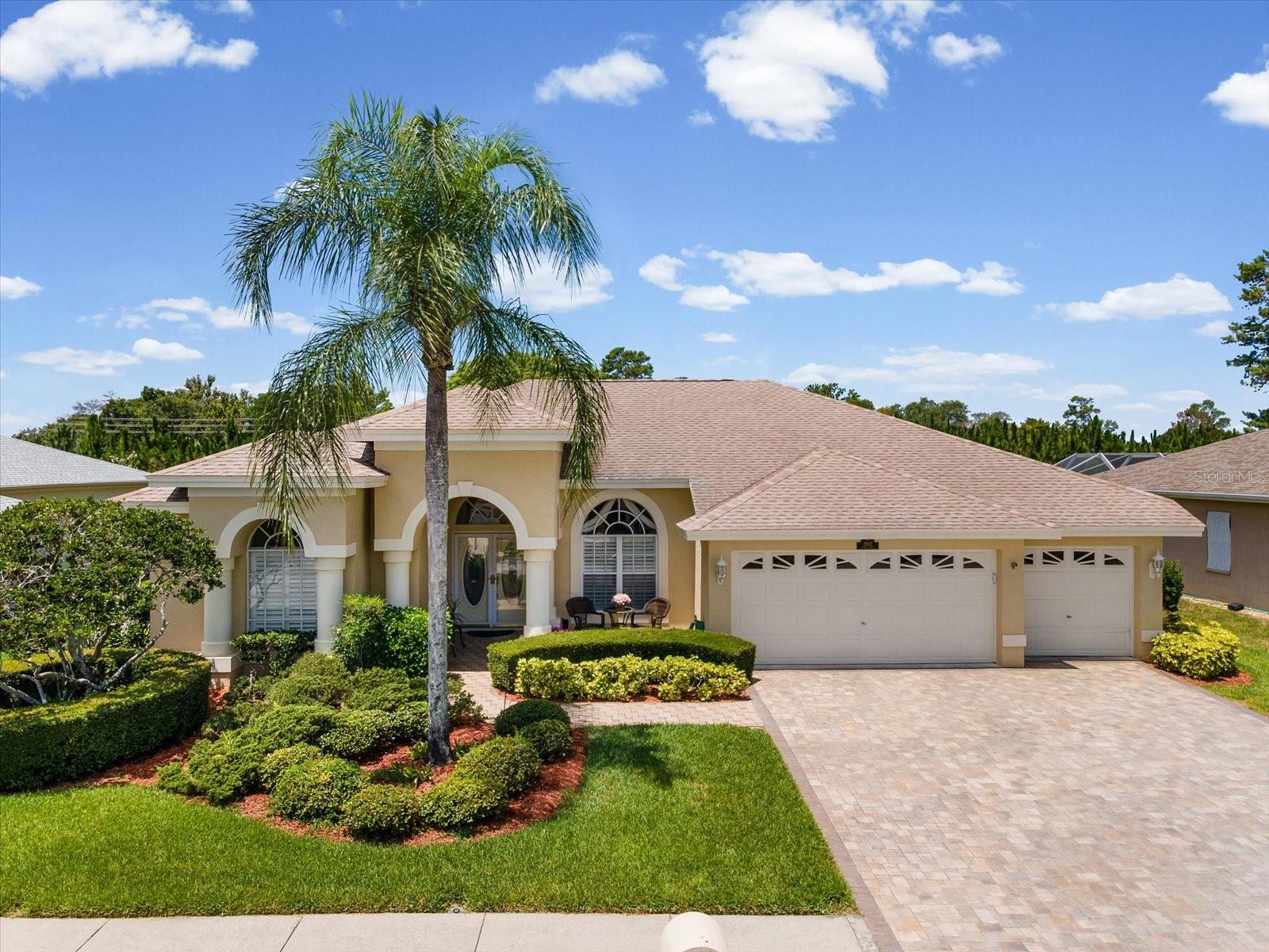 Welcome to your dream POOL Home, meticulously maintained and showing its pride of ownership! This lovely 3/2/3 split-floor-plan, open-concept home is what you've been waiting for. Upon entering, you will notice the beautiful laminate flooring and large tile floors throughout the home. You'll love the high ceilings & fans in almost every room! The open floor plan is very generous, with an ample dining & living room and a beautiful, spacious kitchen/family room that overlooks the enclosed/screened-in pool area. The kitchen features beautiful stone countertops, reverse osmosis, recessed lighting, plenty of cabinets, an oversized island/breakfast bar & dinette area. The primary bedroom and ensuite include 2 walk-in closets, dual sinks, an oversized walk-in shower, and a large bathtub area. By the way, you can sneak out for a quick dip since you also have an entrance to the lanai/pool area from your primary bedroom. What more could you ask for? How about 2 more generously sized bedrooms, plantation shutters in most rooms, a laundry room, plenty of closet space, a 3-car garage, a private well for irrigation, and the roof was replaced in 2018. Your low quarterly HOA fee includes lawn mowing, outside pest control, internet, cable, trash, and recycling. Located in "The Reserves" part of The Estates of Beacon Woods, a well-maintained Community offering a  Clubhouse, Fitness Center, Lighted Tennis Courts, Pickleball, Library, Billiards, Ping-Pong, Shuffleboard & Community Pool. This is a family & pet-friendly neighborhood with easy access to nearby amenities, including Restaurants, Beaches, Hospitals, Veterans Memorial Park, Tampa/St. Pete Airport and sunset dining near the Gulf of Mexico. Why wait any longer? Contact us today for a private showing and see what your little bit of paradise could be!