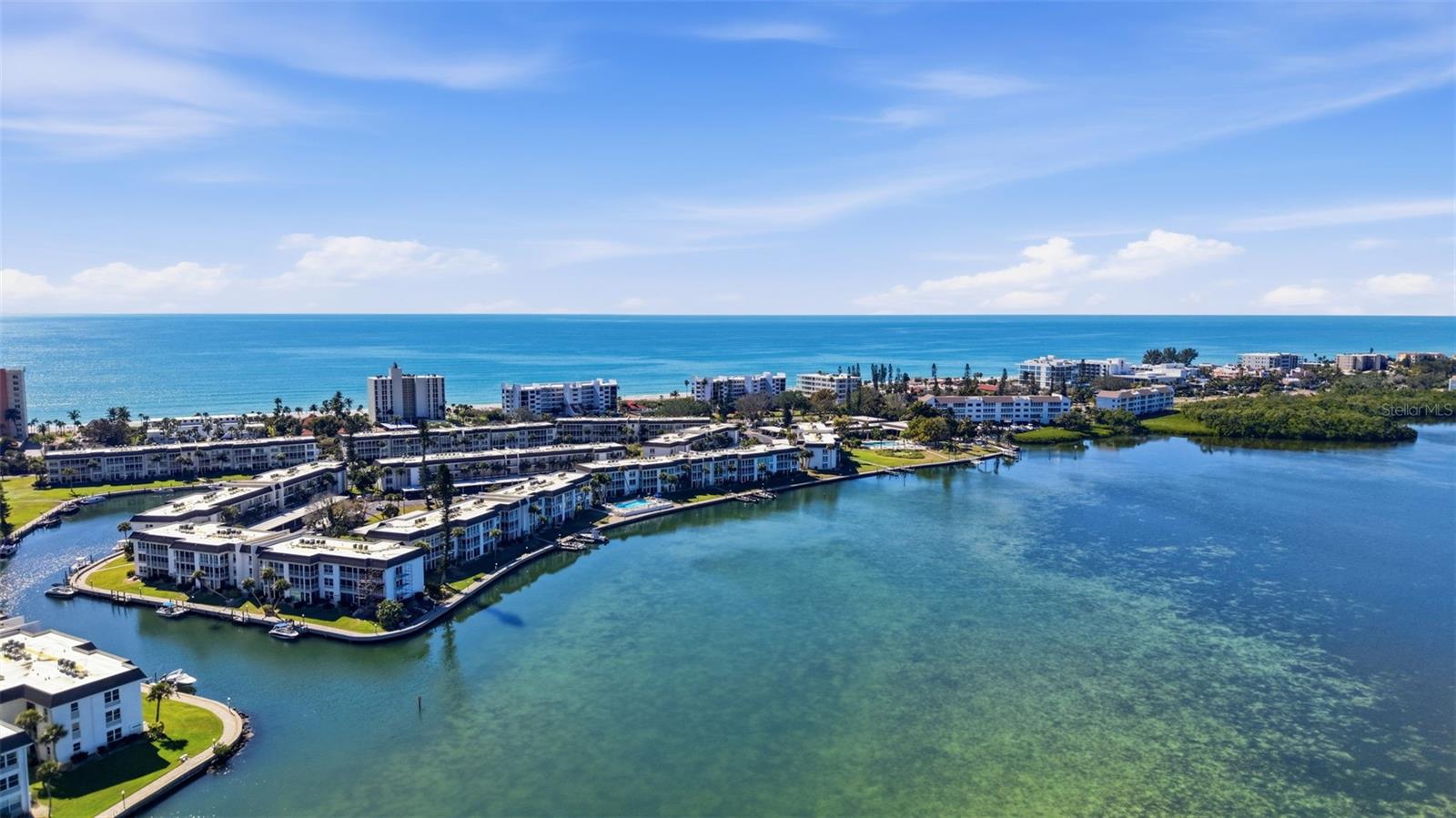 Welcome to Longboat Harbour, a gated waterfront community offering resort-style living on beautiful Longboat Key. This first-floor corner unit, N-106, features two bedrooms, two baths, and an assigned covered carport — all set against unparalleled views of Sarasota Bay and the Intracoastal Waterway.
Step inside to find ceramis plank flooring throughout and a light-filled, open layout designed to maximize both comfort and scenery. The bright kitchen offers a convenient pass-through to the dining area and living room, allowing you to stay connected with guests while preparing meals.
The spacious living room is lined with windows facing the water, delivering breathtaking sunrise views each morning. Sliding glass doors from both bedrooms open to a tiled three-season lanai, complete with additional sliders that lead directly to the outdoors — perfect for embracing Florida’s coastal lifestyle. Both bathrooms feature elegant granite countertops for durability and easy maintenance.
?? Exceptional Community Amenities Include: Private Beach Club with Parking, Four heated pools, Tennis and pickel balls courts, Fitness center, Clubhouse, On-ste manager and boat docks. (Available on a first come basis for sail or power boats)
Whether you’re seeking a full-time residence, seasonal retreat, or investment opportunity, this waterfront gem offers the perfect blend of luxury, comfort, and active coastal living.