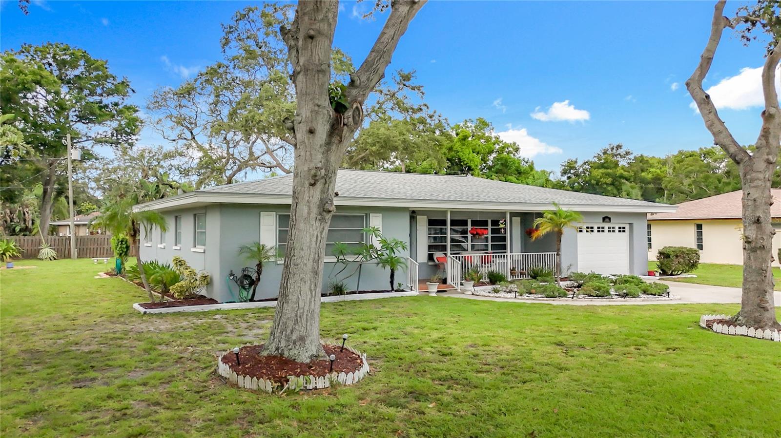 High, dry, and just minutes from the Gulf! This concrete block gem sits on a massive 0.37-acre lot in a coveted non-flood, non-evacuation zone. Featuring a brand-new roof (2025) and an upgraded 200-AMP electrical panel, this property is primed for your dream heated pool, spa, or backyard tiki oasis. Inside, spread out across 2,114 square feet of sunlit, single-level living space. The smart split-floor plan boasts three oversized ensuite bedrooms for ultimate privacy. With multiple versatile living areas, you can easily design a custom home office, media room, or formal dining space. Park and store gear in the oversized garage, then walk to local wine bars, breakfast spots, and boutique shops. Best of all, you are under 5 minute ride from the beach at 1.9 miles. Just a 30 minute ride to St. Pete Beach, and 15 mins to Clearwater Beach. Airports-  15 minutes from St. Pete Airport, and 30 minutes from Tampa International Airport.