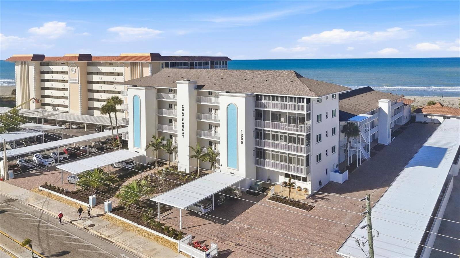 Major Price Reduction!! This property is ready for your personal touch. The views are fantastic as you gaze out over the Gulf, breath in the fresh sea air and maybe catch a dolphin family frolicking in the surf. This two-bedroom, two-bathroom condo has a nearby designated parking space in addition to ample guest parking. The convenience of the downstairs storage area for your beach items will help keep the sand out of your unit. Chateaugay is a wonderful community with social activities on holidays and cocktails at sunset, book and card clubs, potluck dinners and food trucks during the season. Or you can simply enjoy the heated pool, green space, and private beach access. You may enjoy the recently upgraded parking areas with attractive brick pavers and newer carports. The pool was completely redone in 2025, along with a new expanded pool surround and patio. The entire complex has hurricane impact windows and sliders installed as well as new front doors to each unit. The building exterior has been painted along with new landscaping throughout the property! Buy into this great complex before the prices go up next season! This condo is a short walk to Crow's Nest Restaurant, Venice Yacht Club, Freedom Boat Club, and Higel Marine Park and an easy bike ride to all things downtown!