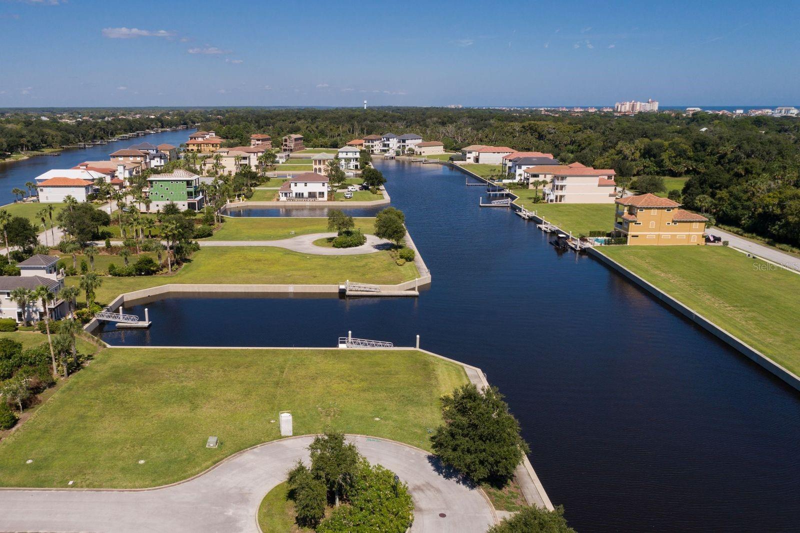 Beautiful cul-de-sac homesite located on a canal directly across the street from the Intracoastal Waterway. 151 feet of waterfront canal frontage (rear and side waterfront views) in the gated community of Yacht Harbor Village! Bring your boat – this homesite has an existing dock. ADJACENT LOT AVAILABLE – 10 CUTTER COURT.  No time limit to build so use the dock now, build later. Permit ready – HOA approved plans are ready to build or build your own custom dream home. The lots are cleared, filled and ready to build on. Embrace the coastal lifestyle, where panoramic water views become your daily backdrop. Yacht Harbor is a beautiful gated, maintenance free community offering all exterior lawn & tree care. Amenities are offered through Hammock Beach Club memberships which include access to on-site Hydro-Grid clay tennis and pickle ball courts, state of the art fitness center and luxurious pool area. The Club membership extends to also include 2 championship golf courses/clubhouses, dining, a fantasy pool complex with 6 pools and lazy river, waterslides, beach access, fitness center, spa and much more – making this an opportunity that extends beyond the walls of your home! Home plans available for viewing
