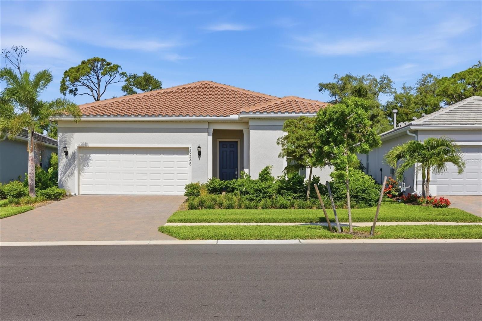Skip the wait and expense of new construction! This beautifully upgraded, tastefully furnished turnkey Prestige floor plan is ready for immediate enjoyment in the highly desirable BeachWalk by Manasota Key community. Backing to a quiet preserve-like setting, you'll enjoy added privacy while relaxing by the custom screened saltwater pool and extended covered lanai.

Designed with a desirable split-bedroom layout, this open-concept home features a tray ceiling in the gathering room and a gourmet kitchen with quartz countertops, upgraded cabinetry, stainless steel appliances, designer pendant lighting, and a large center island. The versatile flex room is currently being used as a den but can easily serve as a third bedroom. The spacious owner's suite offers a luxurious bath with a floor-to-ceiling tiled shower and frameless glass enclosure, while the guest suite includes its own ensuite bath and walk-in closet.

Additional highlights include 8-foot interior doors, upgraded lighting and hardware, epoxy-coated garage floor, built-in ceiling speakers, CAT6 wiring, laundry room cabinetry, and a Vitek smart home system that integrates security and climate control. Move right in and start enjoying the Florida lifestyle!