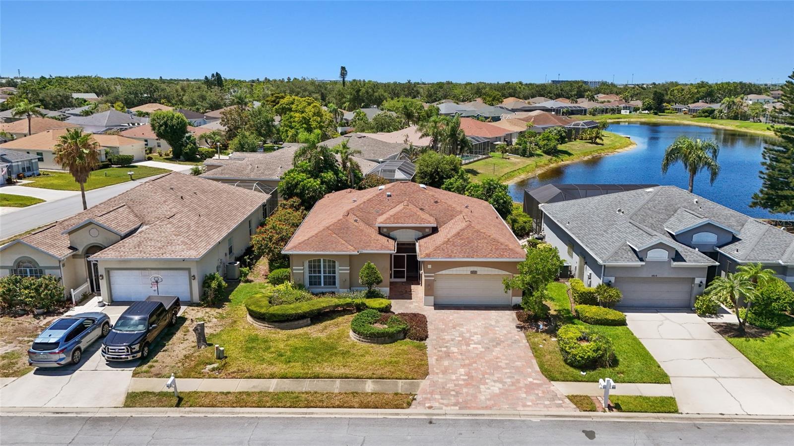 FULLY FURNISHED & CLOSE TO IMG. Welcome to Glenn Lakes! This 3 bedroom, 2 bath fully furnished home offers a split floor plan, spacious living areas, and a peaceful setting in a convenient West Bradenton location. From the moment you enter, you'll notice the natural light, high ceilings, and crown molding that make the home feel bright and inviting. The kitchen is equipped with white cabinetry, stainless steel appliances and seamlessly connects to the main living areas, making entertaining effortless. Vinyl and tile flooring add both style and functionality throughout the home. The primary suite is privately situated at the rear of the home and features dual walk-in closets, dual vanities, and an en-suite garden bath with a walk-in shower. Two additional bedrooms are situated at the front of the home and provide generous closet space and flexibility for guests, family, or a home office. Sliding glass doors lead out to the screened lanai where you can enjoy a pond view and outdoor living space. The lanai area also includes a hot tub, creating a relaxing spot to unwind at the end of the day. Additional highlights include an indoor laundry room with a washer and dryer and a 2-car garage. Located in the Glenn Lakes community near IMG Academy, IMG Golf Club, Gulf beaches, shopping, dining, Sarasota-Bradenton International Airport, and everyday conveniences. Move right in and start enjoying everything the Florida lifestyle has to offer.