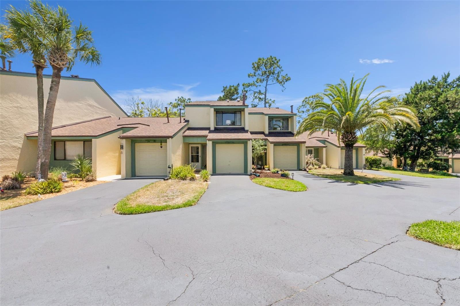 Welcome to 201 Club House Blvd in beautiful New Smyrna Beach , a charming townhome nestled within the highly desirable Sugar Mill golf community. This spacious 2-bedroom, 2.5-bath residence offers the perfect blend of comfort, convenience, and low-maintenance Florida living. Step inside to find a bright and inviting layout with generous living spaces, abundant natural light, and a functional floor plan ideal for both full-time residents and seasonal getaways. Enjoy peaceful mornings and relaxing evenings surrounded by lush golf course community scenery. Residents enjoy access to outstanding HOA amenities, including a community pool, beautifully maintained grounds, and the lifestyle that comes with living alongside a premier golf course community. Conveniently located just minutes from shopping, dining, historic Canal Street, and the world-famous beaches of New Smyrna Beach, this home offers the perfect balance of tranquility and coastal living. Whether you're looking for a primary residence, vacation home, or investment opportunity, 201 Club House Blvd delivers easy Florida living in one of the area's most sought-after communities.