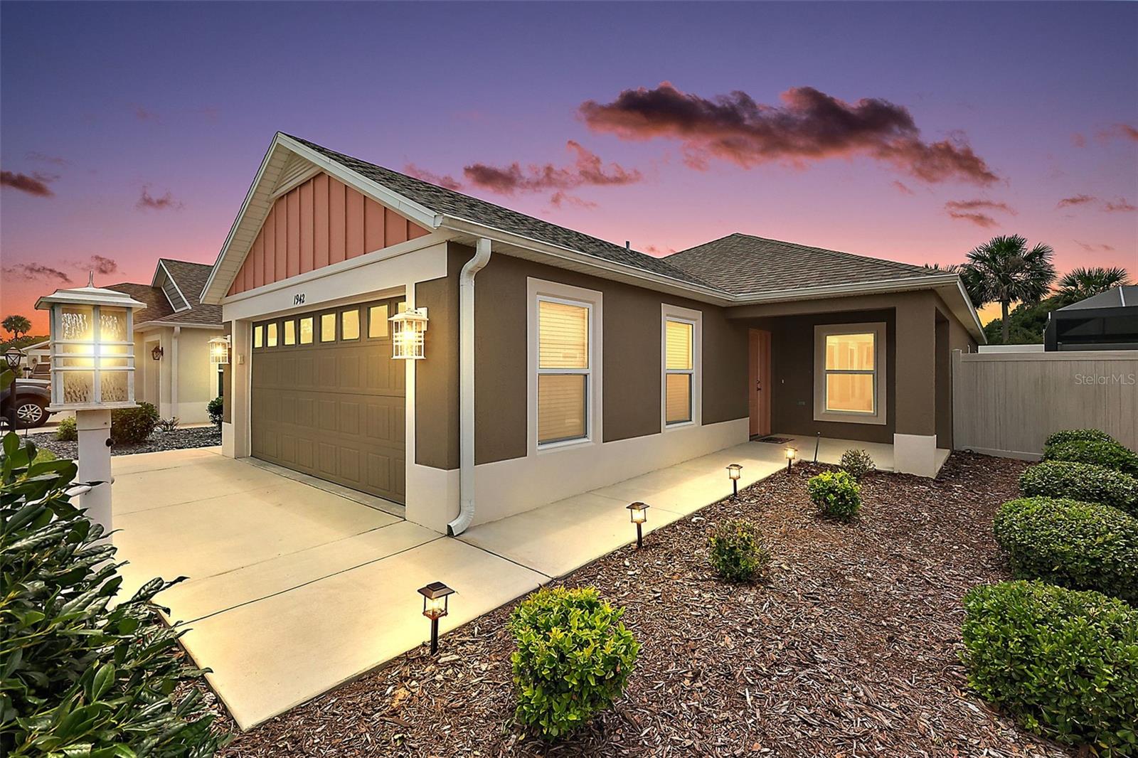 FABULOUS TURNKEY 2/2 BLOCK and STUCCO Durham Bungalow Villa with SPACIOUS ENCLOSED REAR YARD and a FULL 2-CAR GARAGE in the highly sought after CONTEMPORARY Village of St Johns! JUST MINUTES to the popular Sawgrass Grove and Brownwood Paddock Square with live nightly entertainment! Built in 2022, this nearly new home offers LOW-MAINTENANCE peace of mind with MODERN design! A beautiful side-lit entry door welcomes you into the BRIGHT and SPACIOUS foyer. Beyond, the OPEN-CONCEPT living, dining, and kitchen areas showcase SOARING VAULTED ceilings, STUNNING neutral-toned TILE flooring, and tasteful finishes throughout. Multiple windows and two sets of sliding glass doors bathe the home in an ABUNDANCE of NATURAL LIGHT, creating an airy and inviting atmosphere perfect for both everyday living and entertaining. The AMAZING kitchen showcases elegant ESPRESSO cabinetry, a SPACIOUS WALK-IN PANTRY, STAINLESS appliances with GAS cooking, and a LARGE COUNTER-HEIGHT peninsula with EAT-IN seating - ideal for casual everyday dining. The lovely, adjoining dining room features CONVENIENT sliding glass doors to the side courtyard  - perfect for grilling!  From the living room, another set of sliding glass doors, invite you to enjoy true Florida living in the screened LANAI overlooking the PRIVATE, FULLY-ENCLOSED rear yard! It also features an exterior door to the adjacent SIDE COURTYARD. This wonderful retreat offers plenty of room for pets, lounging, dining, and year-round outdoor entertaining! Whether sipping your morning coffee, hosting a weekend barbecue, or unwinding after a long day, this FANTASTIC space is your own PRIVATE ESCAPE! Back inside, the LUXURIOUS primary bedroom features a TRAY ceiling, DOUBLE windows, and a SPACIOUS WALK-IN closet. Its en-suite bathroom boasts ESPRESSO cabinetry; DOUBLE sinks; CORNER ROMAN-STYLE TILED WALK-IN shower; and a SEPARATE water closet. Bedroom two offers a VAULTED ceiling and a built-in closet. The second bathroom features an ESPRESSO vanity, tub and shower combination, and a hallway LINEN closet. A CENTRALLY LOCATED, INTERIOR laundry room has a POCKET DOOR and WHITE cabinetry for extra storage needs. Completing the package is a FULL TWO-CAR GARAGE with a convenient UTILITY SINK. DON’T MISS YOUR OPPORTUNITY to make this MAGNIFICENT HOME YOUR OWN! The Village of St. Johns is IDEALLY SITUATED close to Sawgrass Grove, Brownwood Paddock Square, and the new Eastport Square; seven neighborhood pools and recreation centers (St. Johns; Franklin, St. Catherine, Bradford, Aviary, Hawkins, Homestead); three large regional recreation complexes (Ezell, Everglades, and Rohan); Southern Oaks Country Club and Championship Golf Course; Clifton Cove Putting Course; Mickylee Pitch and Putt; shopping, dining, banking, medical, and more at SR 44 and Magnolia Plaza; and Homestead dog park for your furry friends! PLEASE WATCH OUR WALKTHROUGH VIDEO OF THIS FABULOUS HOME and call today to schedule your Private Showing or Virtual Tour!