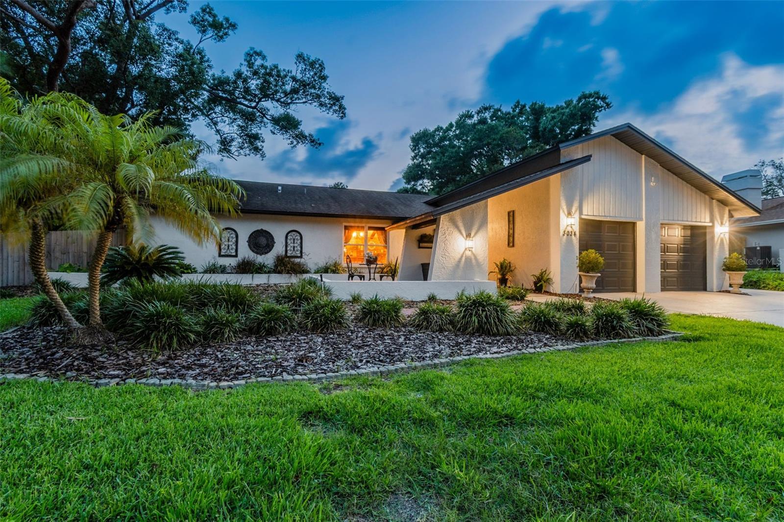 Beautiful Eniswood home situated on a gorgeous oversized lot in highly desirable Palm Harbor. This beautifully maintained 3-bedroom, 2-bath residence sits on over 1/3 acre and offers the perfect combination of privacy, comfort, and extensive upgrades throughout. Highlights include a perfect roof, newer appliances, 1-year-old AC, 3-year-old water heater, tile flooring throughout for easy maintenance, fresh interior and exterior paint, updated popcorn ceilings, a 5-zone irrigation system with reclaimed water, and a warm wood-burning fireplace.

Designed with both everyday living and entertaining in mind, the spacious split floor plan features a large primary suite, eat-in kitchen, separate dining room, and indoor laundry with washer and dryer included. The kitchen is equipped with top-of-the-line stainless steel appliances, tile flooring throughout, newer windows and thoughtful finishes create a light, bright, and warm atmosphere!

Step outside to your own private backyard retreat featuring mature landscaping, abundant shade, an outdoor shower, saltwater pool, resurfaced pool cage, pavered outdoor spaces, and an impressive entertaining area complete with cabinets, sink, and TV hookup, perfect for enjoying the Florida lifestyle year-round.

An exceptional bonus is the stunning custom she-shed with over $15,000 invested, offering endless possibilities as a home office, creative studio, side business space, guest retreat, fitness room, or potential future in-law suite.

Located near award-winning beaches, restaurants, shopping, parks, and top-rated A-rated schools, this completely move-in ready Palm Harbor home combines flexibility, functionality, and relaxed Florida living. Just bring your clothes and start enjoying everything this exceptional property has to offer.