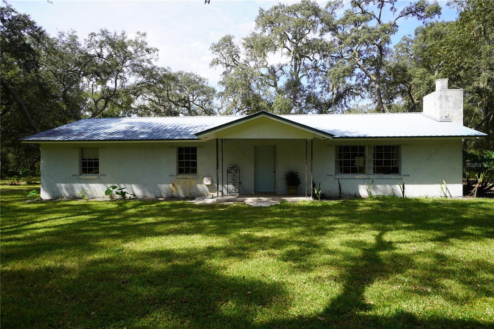 2.3 acres of land and a home that needs work to bring it back to life.  Looking for country living?  You can have it here.  No HOA or CDD to worry about.  Lots of potential and good equity for somebody that wants to make a house a home.  The yard is fenced, has mature trees, a turn around driveway and backs up to no rear neighbors.  House can be remodeled to be a 4 bedroom 2 bathroom, or you could add onto the house since there is a lot of land.  You will also find a 12x24 shed in the backyard.  Low cost living includes septic and well and low taxes!!!