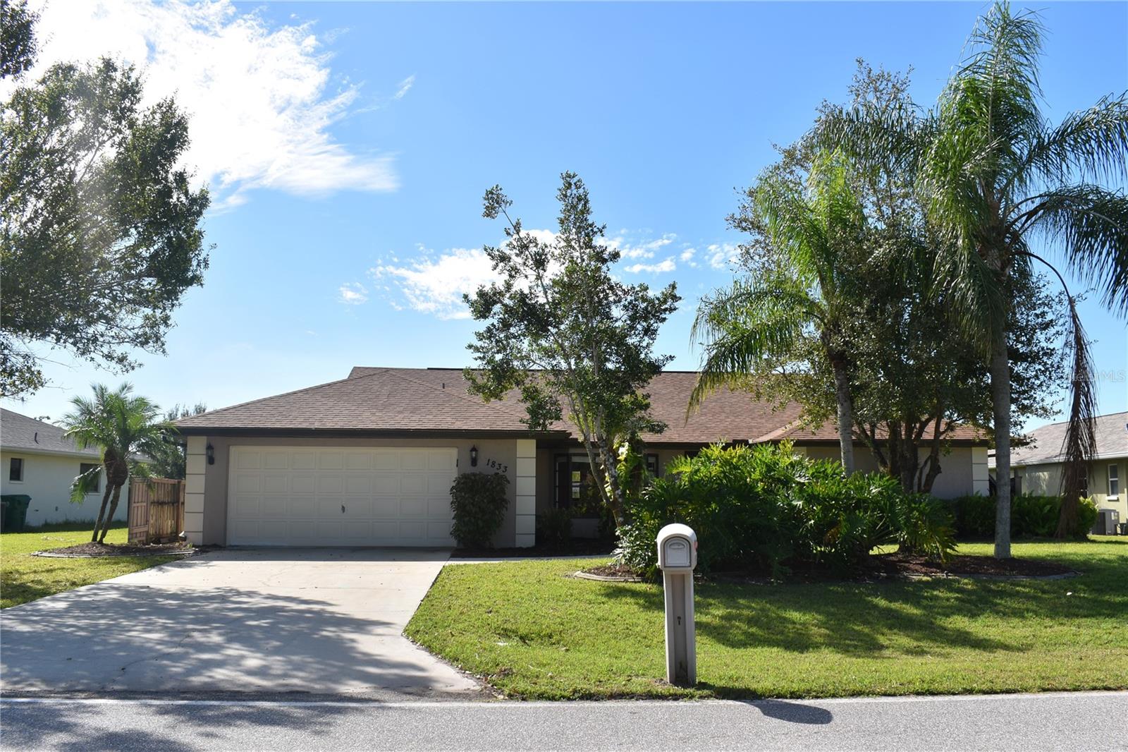Pool home with 2100 SF of living space in a desirable area of Deep Creek. This spacious 3/2/2 home has a large lanai and pavered pool deck with lots of privacy. It features an open concept, split bedroom floor plan with cathedral ceilings and sliding glass doors from the master bedroom, living room and the 3rd bedroom. The Kitchen has wood cabinets and granite counters. There are walk-in closets in all bedrooms and two large closets in the master. The guest bath is also a pool bath for convenience. The home has a new roof that was replaced in 2023 and the whole house has been replumbed with pex piping.