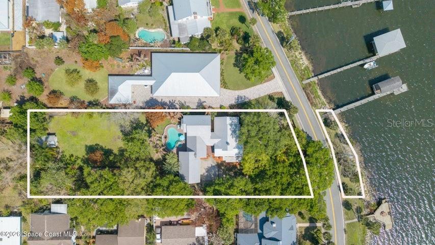 SELLERS MOTIVATED! REDUCED 250K TO APPRAISAL PRICE!! A RARE OPPORTUNITY FOR A ONE-OF-A-KIND HISTORIC HOME BUILT IN 1937 set on 0.97 acres beneath mature oak, maple, & mango trees, this exceptional direct riverfront estate on lovely Rockledge Drive is an extraordinary offering! The home beautifully blends historic character with timeless, high-end finishes & impeccable updates. Designed for the most discerning buyer, it offers 5 bedrms & 5 full baths, sweeping river views from eastern-facing windows and the 2nd floor primary suite,w/ coastal breezes. Boaters will appreciate the custom boathouse, 9,200-lb lift, h20, electric, & approx. 7-ft draw at the dock. A 429-sq-ft walk-up attic space in garage presents ideal potential for in-law or guest suite--just needs sheetrock & your finishes; ONE OF THE MOST DESIRABLE HOMES ON ROCKLEDGE DR!!! Peaceful fenced-in bkyd w/ pool, lanai, bar & shed; Furnishings are negotiable; Too many updates/improvements to list--see supplement