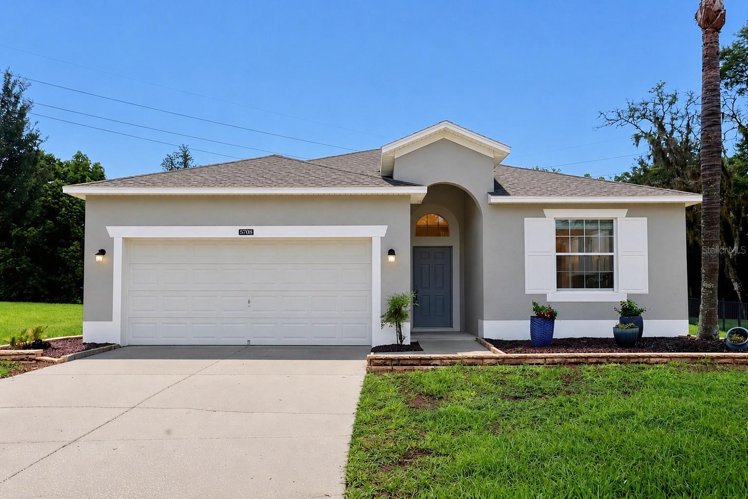 Beautifully renovated home located in the highly south gated community of Stoneybrook Hills. This move-in-ready residence features a brand new kitchen with NEW soft-close plywood premium cabinetry, NEW quartz countertops, and NEW stainless steel appliances. The open floor plan offers abundant natural light, a formal dining room, breakfast nook, high ceilings, NEW LED lighting, NEW wood-look laminate flooring, freshly updated bathrooms with quartz countertops and quality cabinetry. The split-bedroom layout provides a private primary suite with a walk-in closet and spacious ensuite featuring a soaking tub and separate shower. Outside, enjoy a screened covered lanai, paver patio, oversized backyard with room for a pool, and a separate irrigation meter. Residents enjoy 24-hour guarded gate access, clubhouse, community pool, lighted sidewalks, underground utilities, and an excellent location with easy access to Orlando, minutes from Downtown Mount Dora, Publix, restaurants, and major highways.