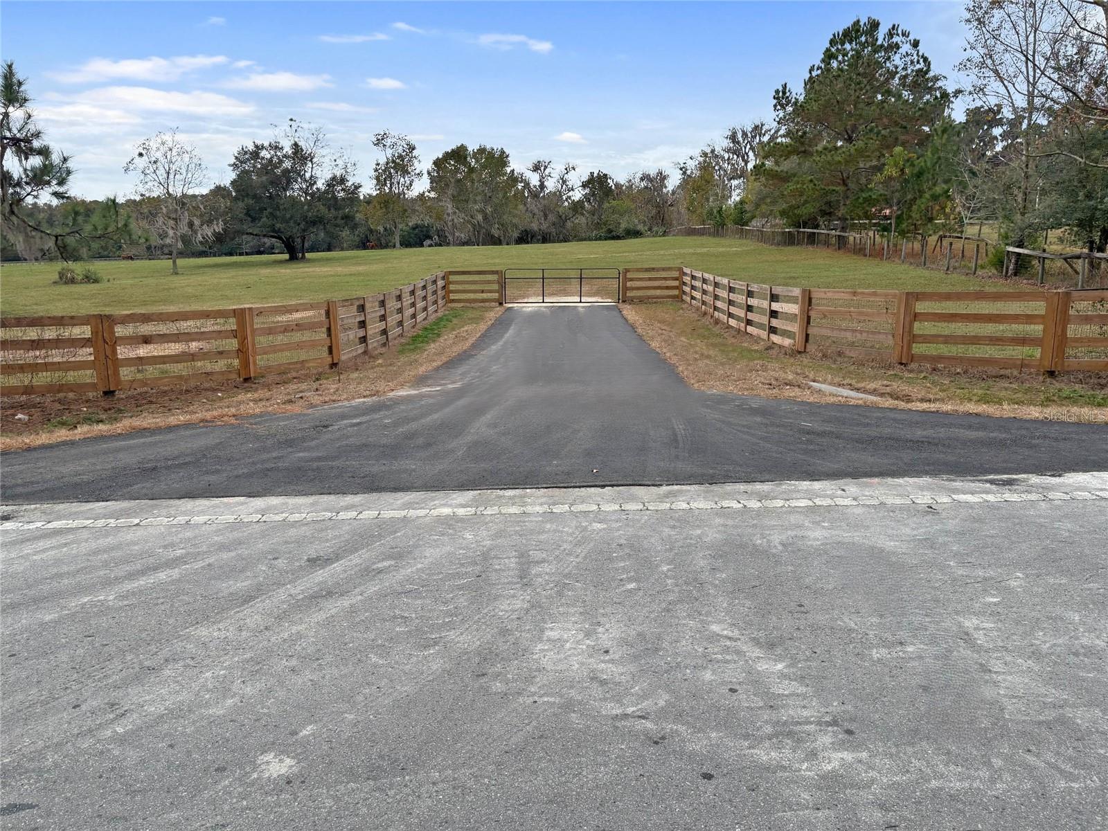 Welcome to this exceptional 16-acre parcel of high and dry land located in one of the most desirable areas of Northwest Marion County. This beautiful tract is fully fenced with lush green grass and is scattered with majestic oak trees offering shade and serenity throughout. It’s the perfect setting to build your dream farm, equestrian estate, or country retreat.
The property is already improved with a well and electric in place, saving you time and money when it’s time to start building. A sturdy  lean-to is ready to be finished into a 3-stall barn or used immediately for equipment, hay, or trailer storage. The land offers ample space for additional barns, an arena, home site, and multiple paddocks.
Located on a paved road with a gated entrance, this property provides easy access while maintaining a quiet country feel. Whether you’re a horse enthusiast, hobby farmer, or just looking for peaceful acreage in a prime location, this land checks all the boxes.
You’ll be just minutes from equestrian venues, trail systems, and amenities—less than 17 miles to the World Equestrian Center and just 10 miles to HITS, with quick access to Williston, Ocala, and I-75.
Don't miss this opportunity to own your own piece of Marion County paradise—ready for animals, ready to build, and ready for you.