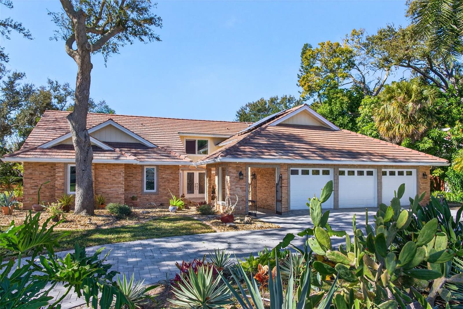 Discover the best of Northwest Bradenton in Riverview Landings, a coveted community renowned for its winding, tree-lined streets, estate-sized lots, and direct access to nature. Situated just a short stroll from the sandy shores and trails of De Soto National Memorial, this residence offers the rare opportunity to enjoy an established, nature-rich neighborhood without sacrificing modern luxury. This home has been completely transformed for peace of mind and exquisite living. The exterior is fortified with a new roof (2022) and brand-new hurricane impact windows and doors (December 2025).  Additionally Solar panels were installed (2022). Inside, the heart of the home is a fully remodeled kitchen (2023) that opens to spacious living areas, ideal for entertaining. The split floor plan features a renovated primary suite (2024) that serves as a true private sanctuary, complete with a spa-inspired bathroom.  Peace and tranquility can be found at the rear / exterior of the home with a newly resurfaced pool / entertaining area.